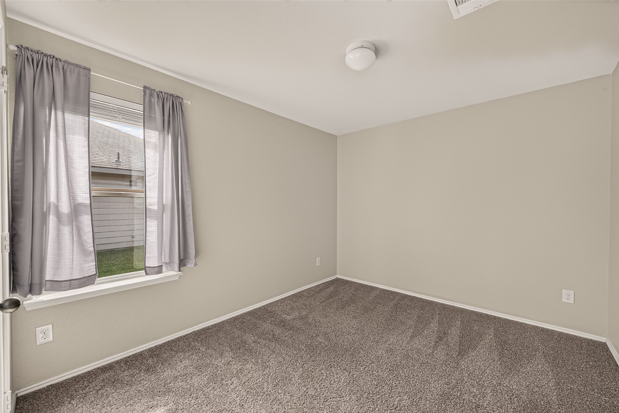 Secondary bedroom is big enough for a queen bed.