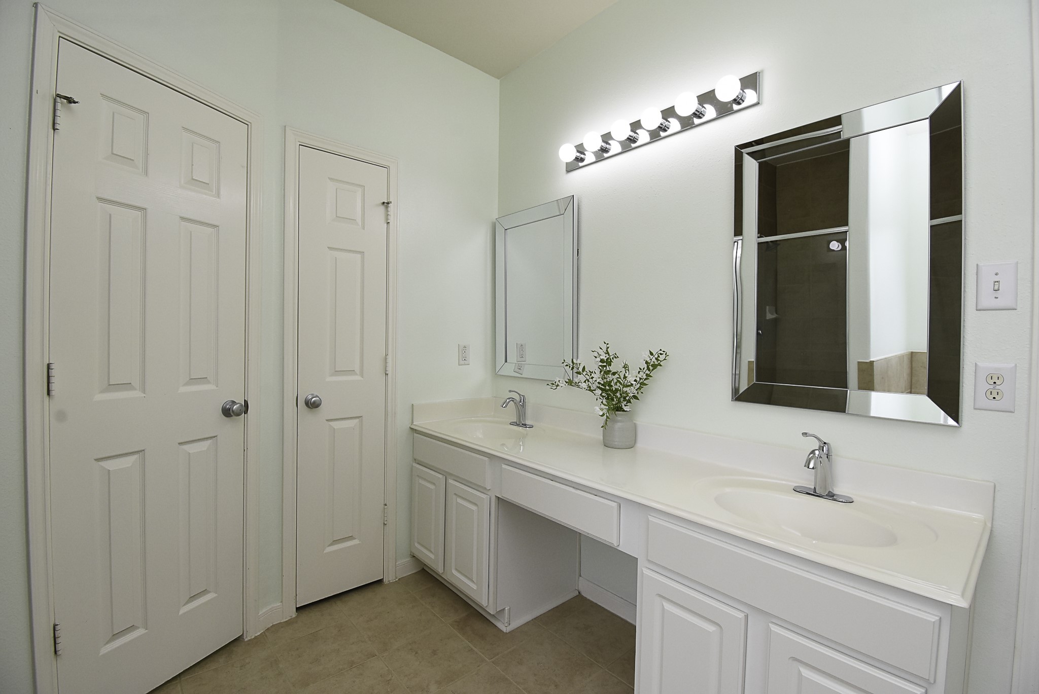Start your day in this spacious primary bathroom.