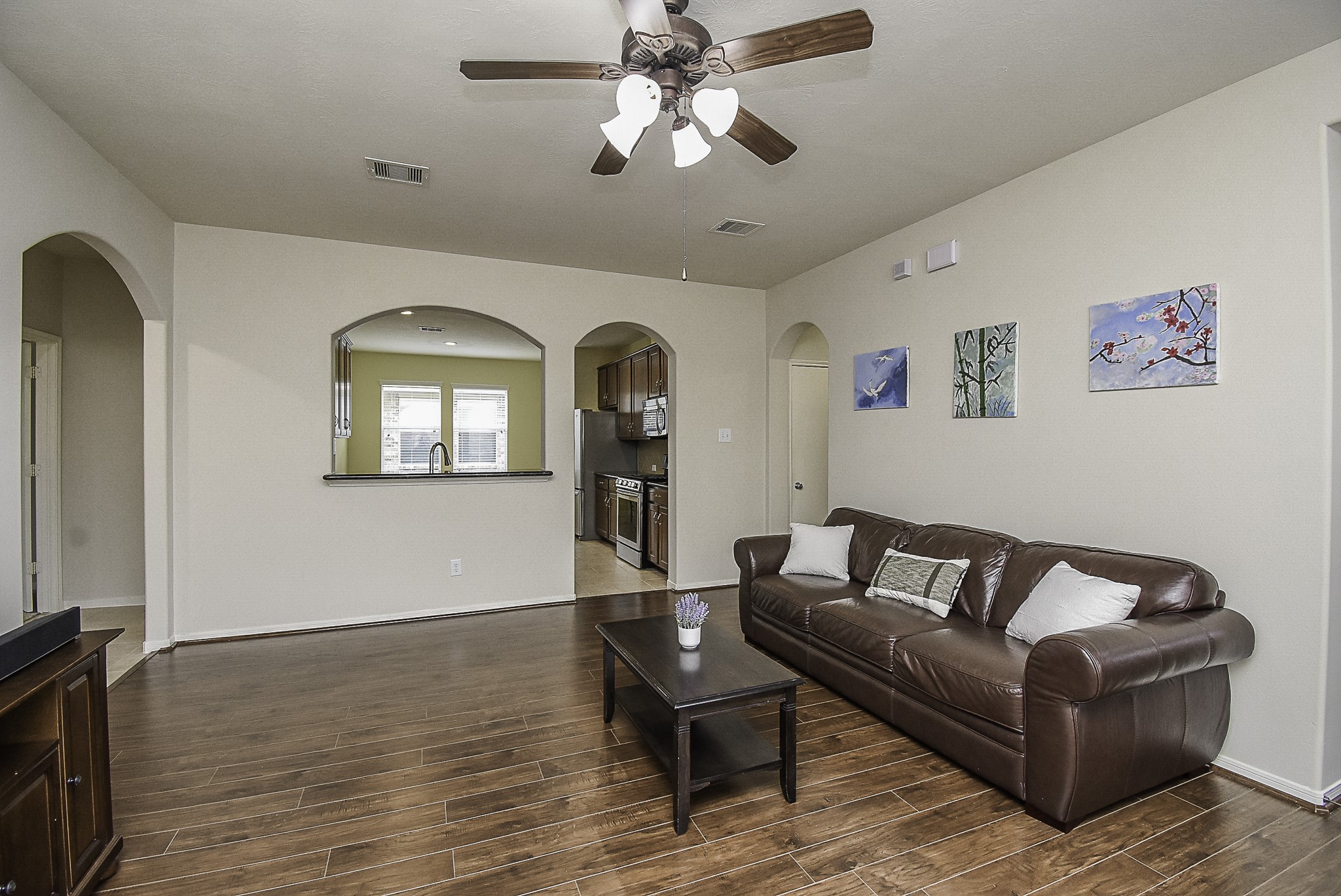 An open layout keeps the living room connected to the kitchen.