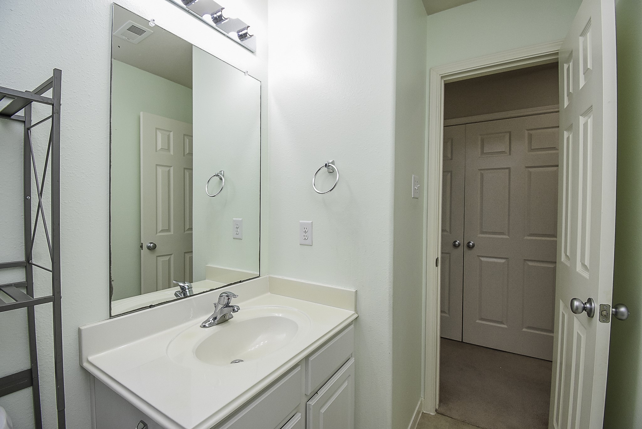 Alternate view of the secondary bathroom showcasing the vanity.