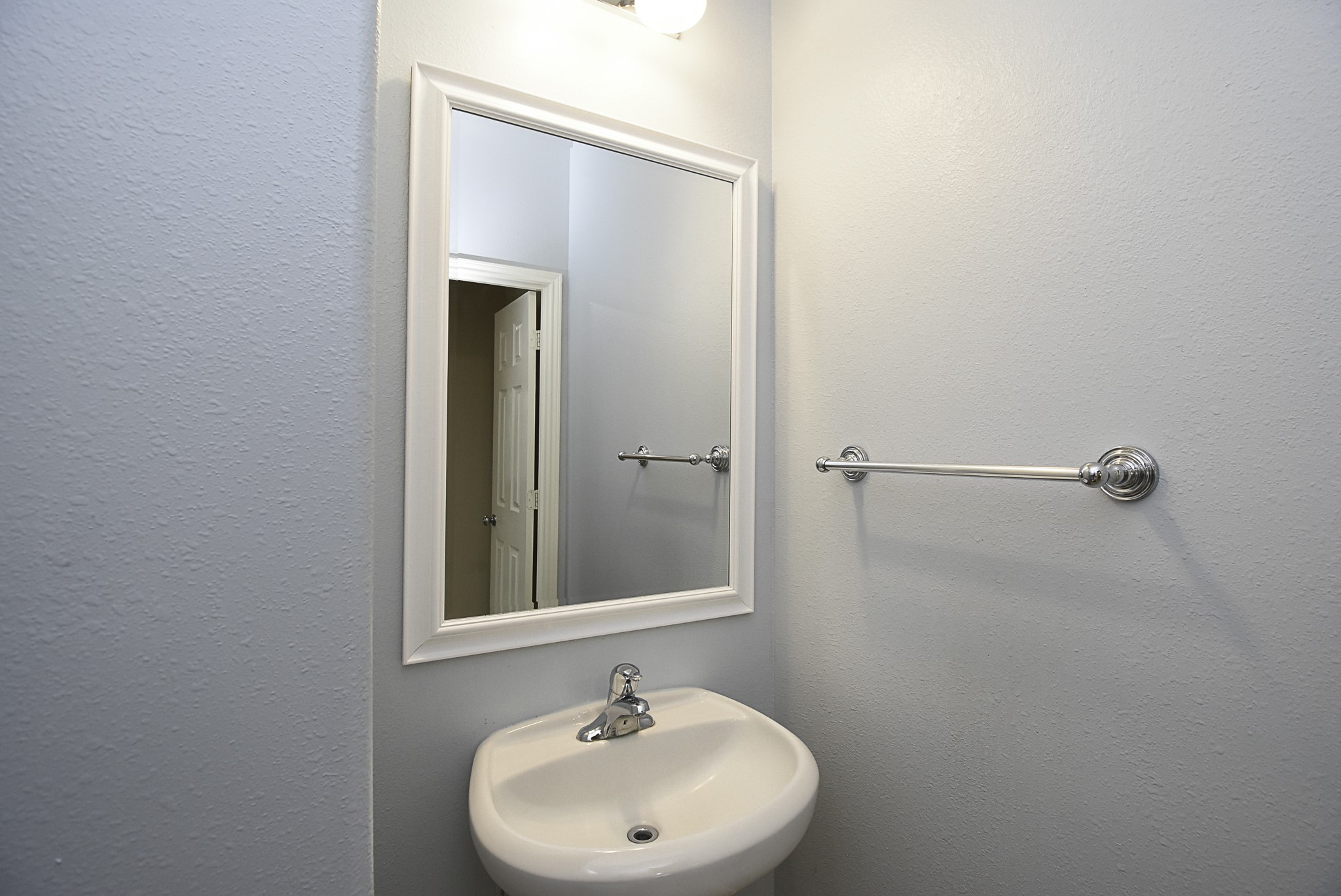 Convenient half bath located just off the living room.