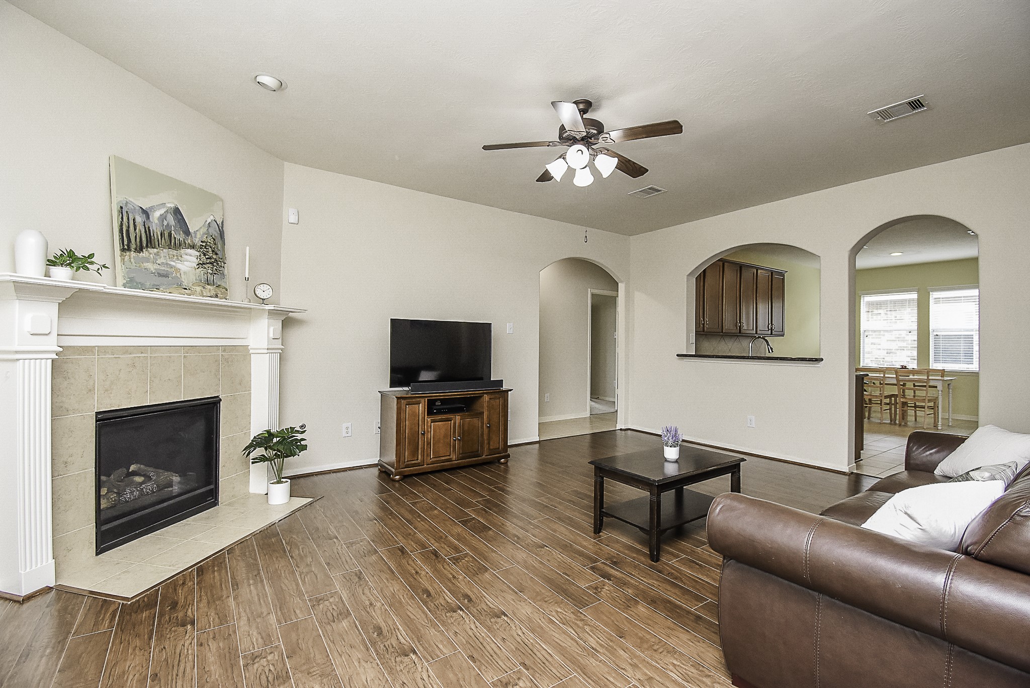 Step back through the spacious living room and make your way to the primary bedroom.
