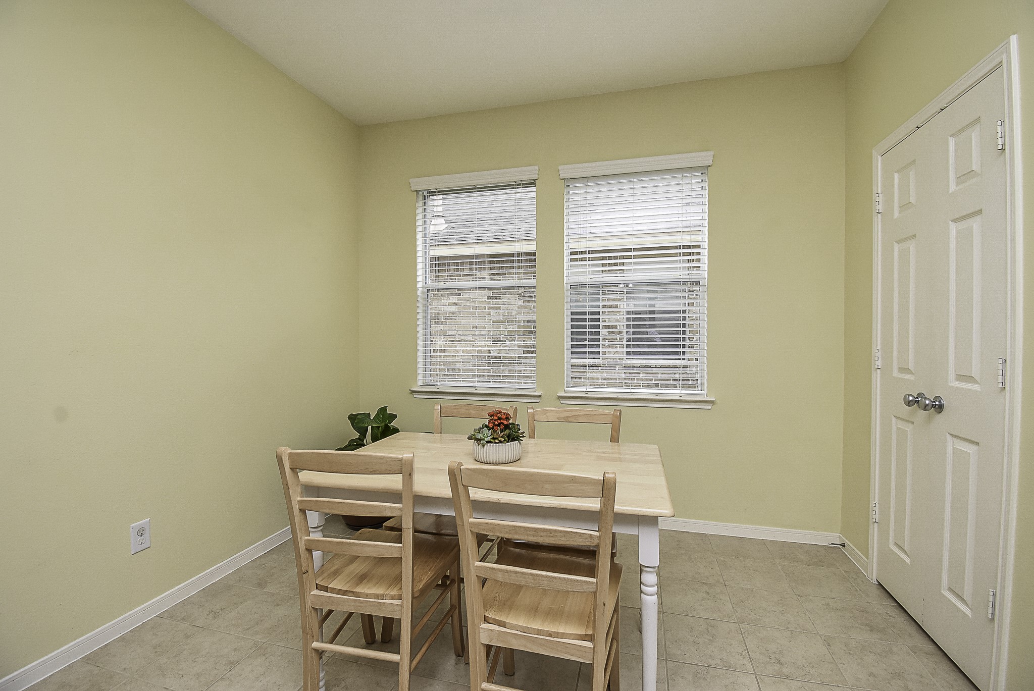 A view of the convenient breakfast area, with the pantry doors on the right.