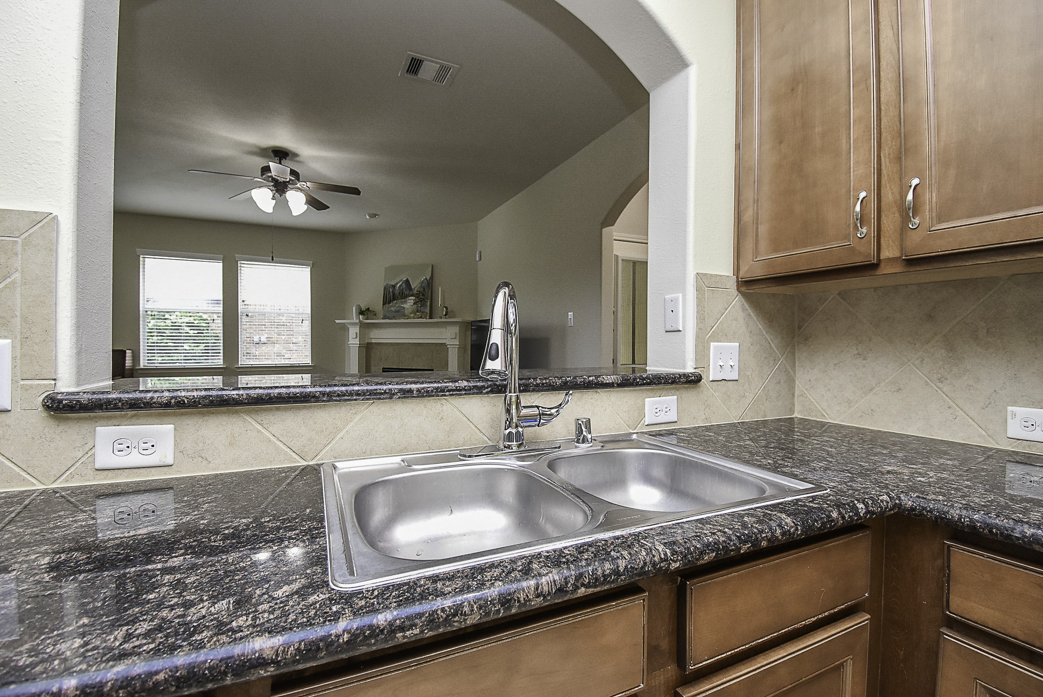 Upgraded pull-down faucet head at the kitchen sink.