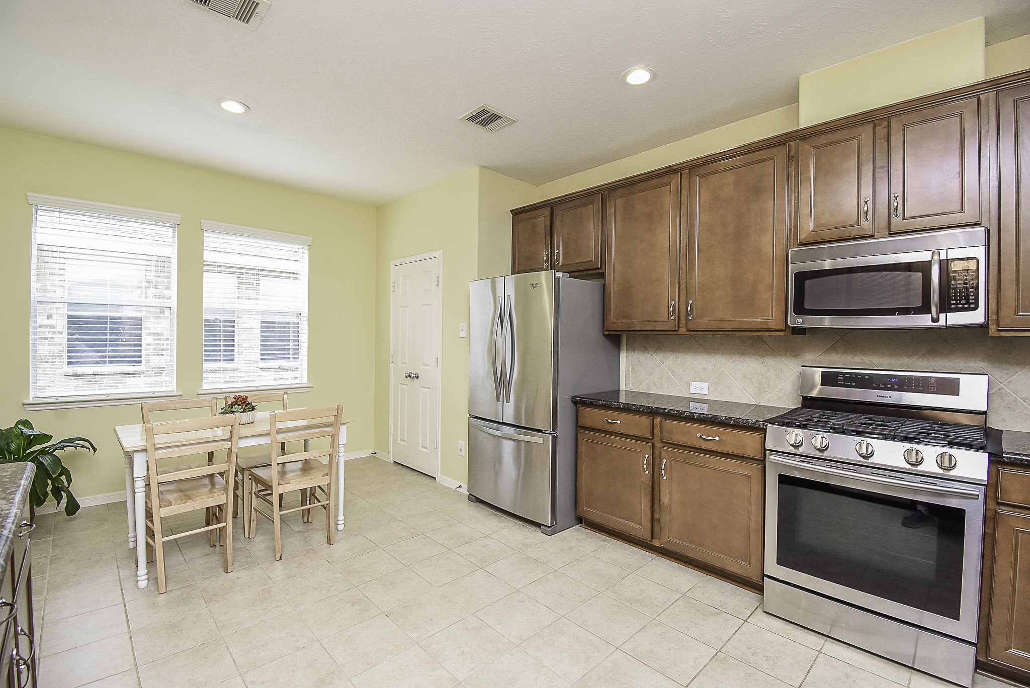 Stainless steel appliances and tile floors make for easy cleaning.
