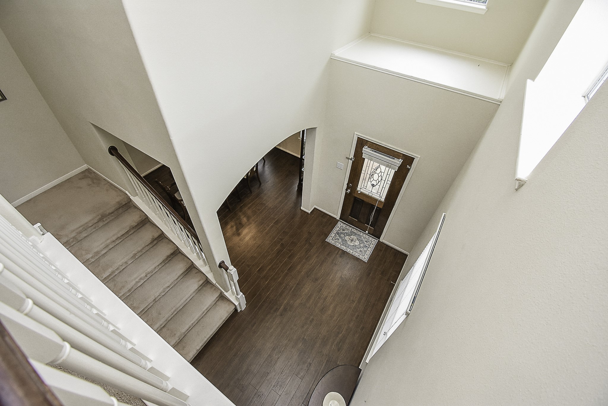 A view from above highlights the soaring foyer and open layout below.