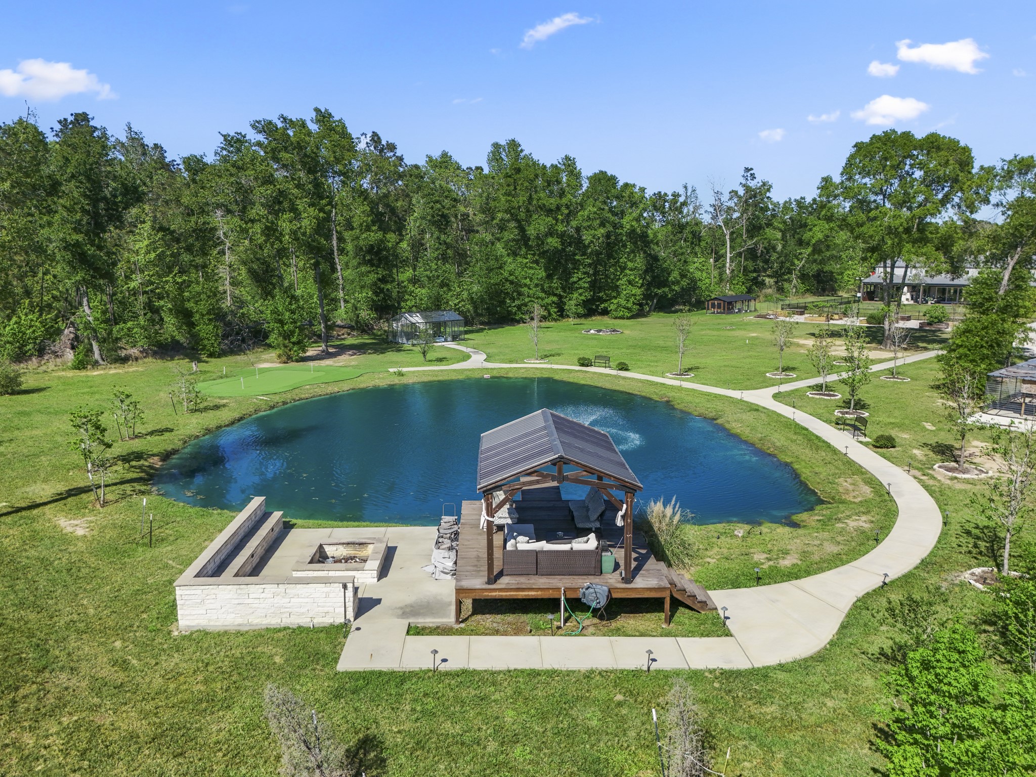 Pond with seating area and dock