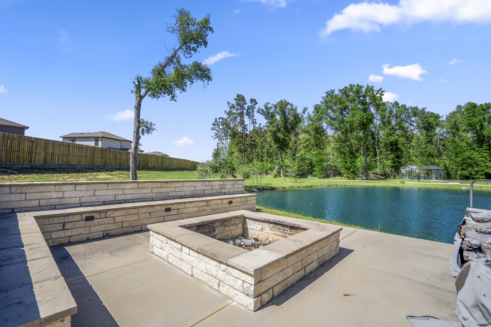 Pond with seating area and dock