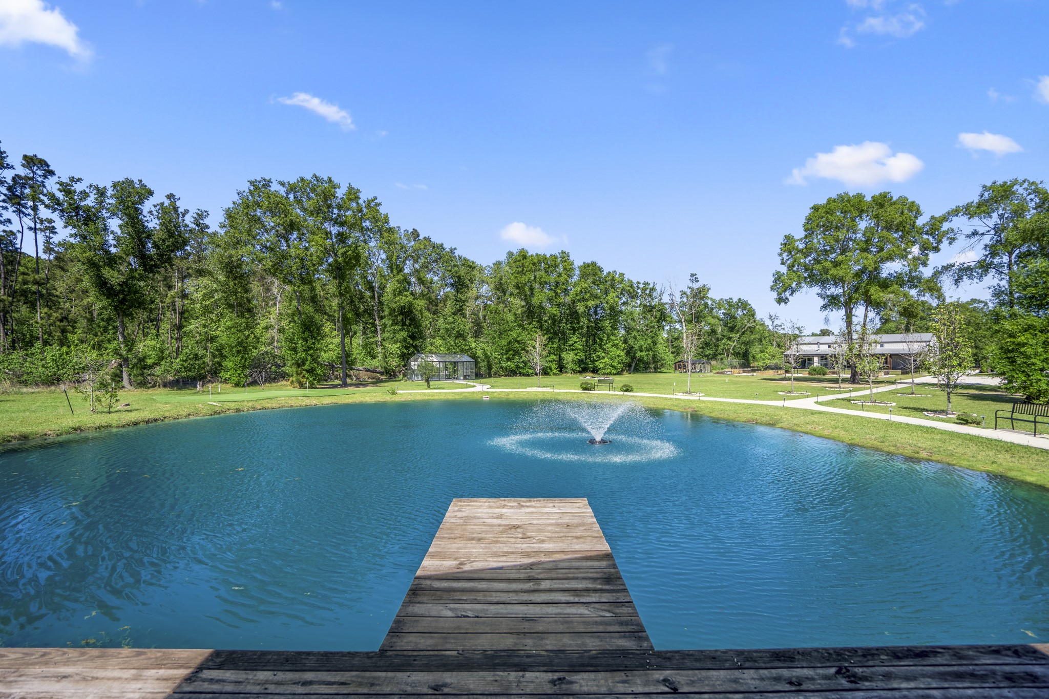 Pond with seating area and dock