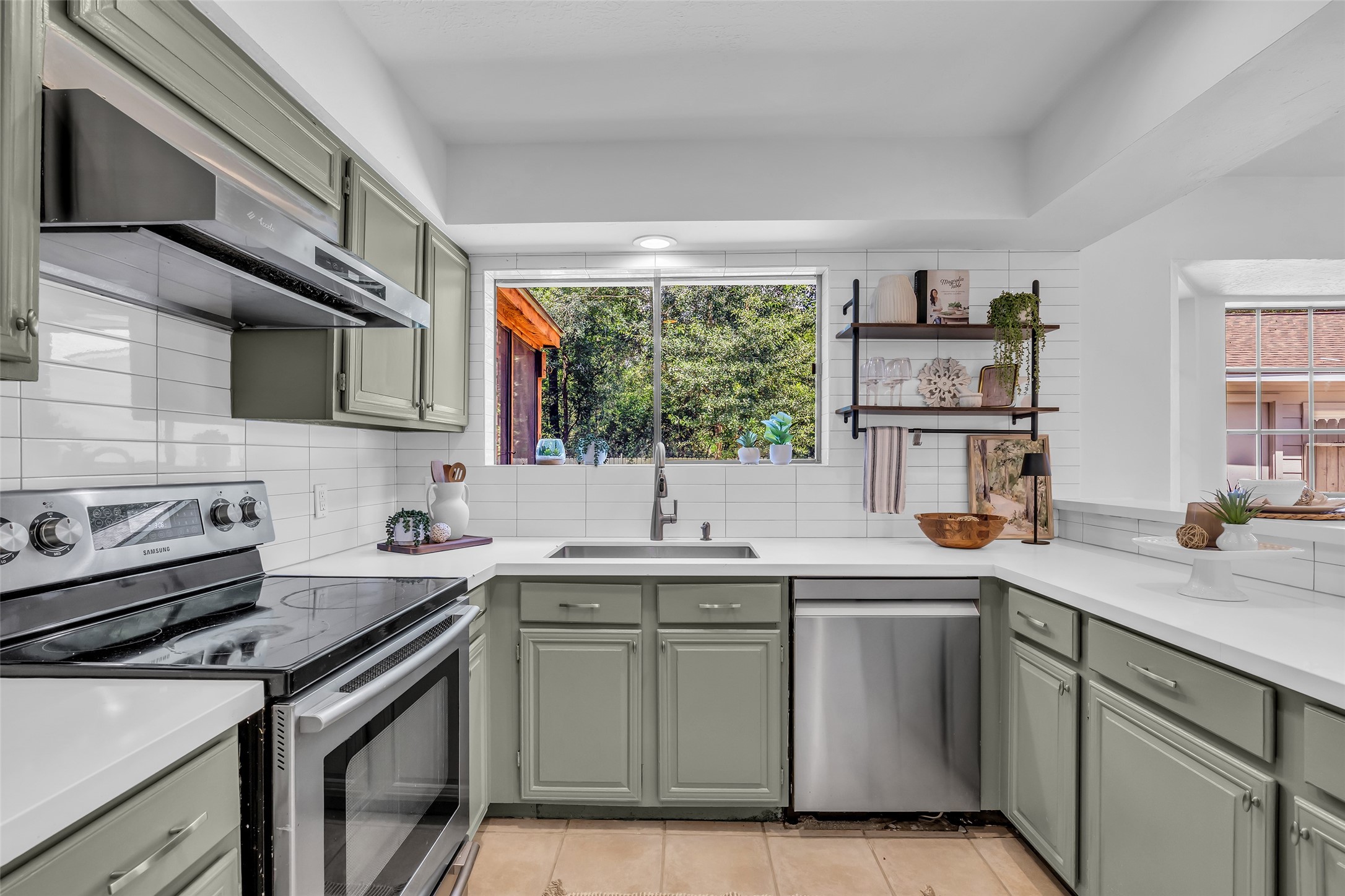 Beautiful view of the backyard/greenspace from the kitchen. Beautiful view of the backyard/greenspace from the kitchen.