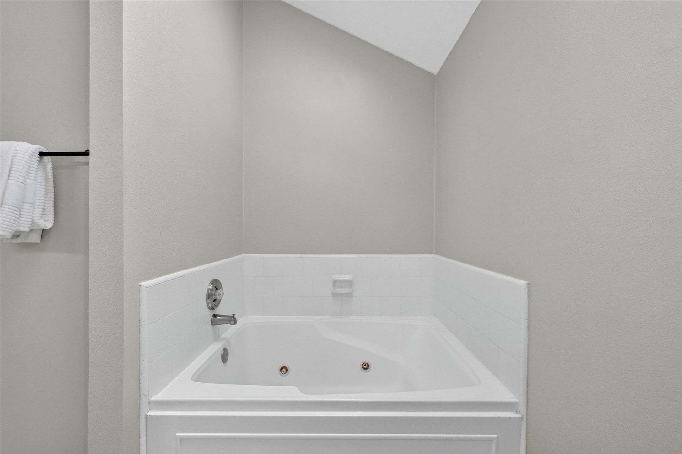 Primary ensuite bath highlight featuring a deep, built-in jetted soaking tubperfect for unwinding with a relaxing bath at the end of the day.