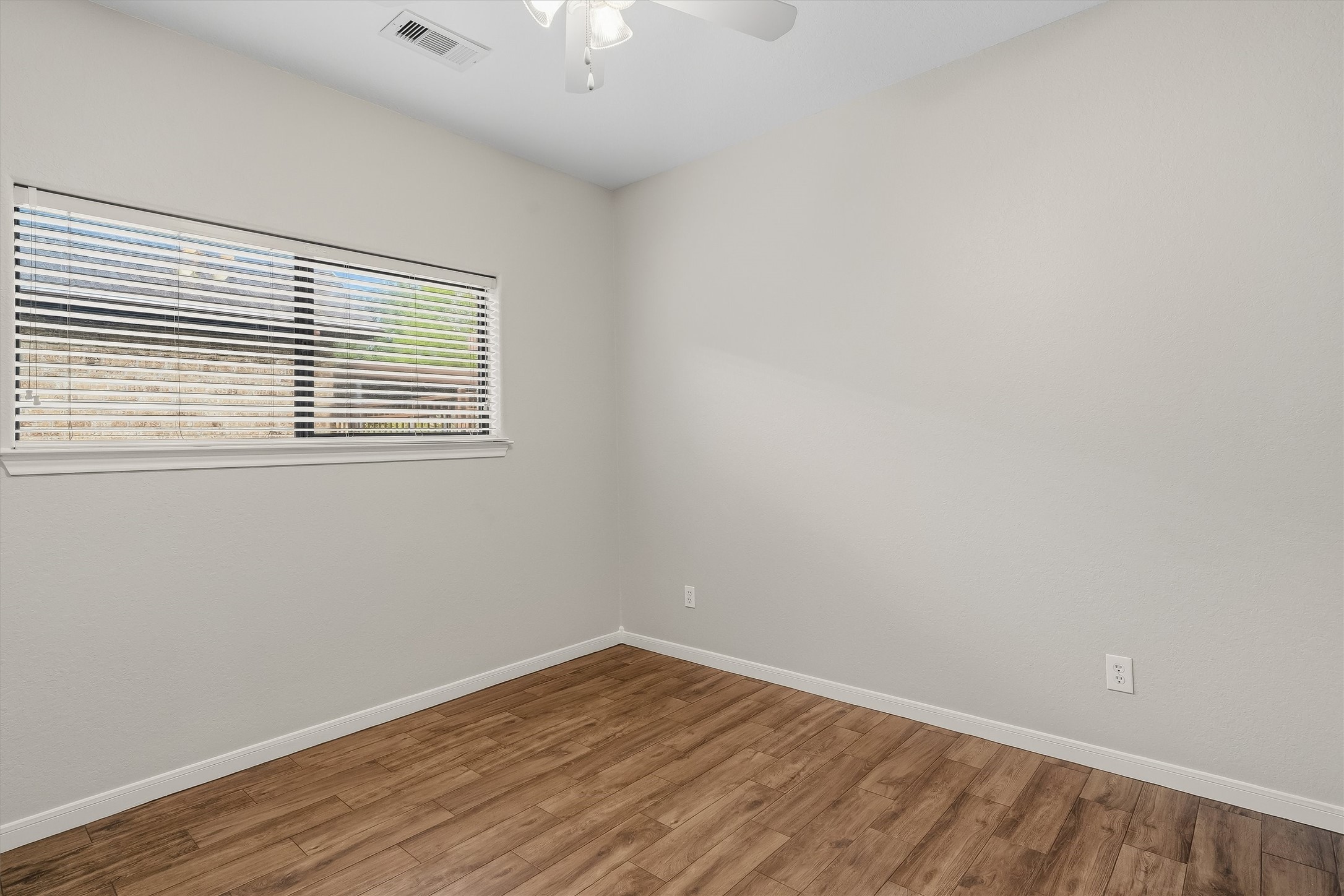 Second bedroom, fresh paint and updated flooring