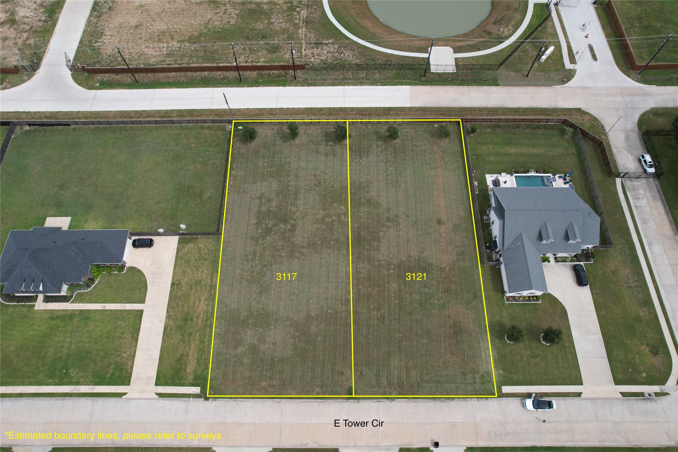 From E Tower Cir perspective. Gate and mailboxes are on the right.