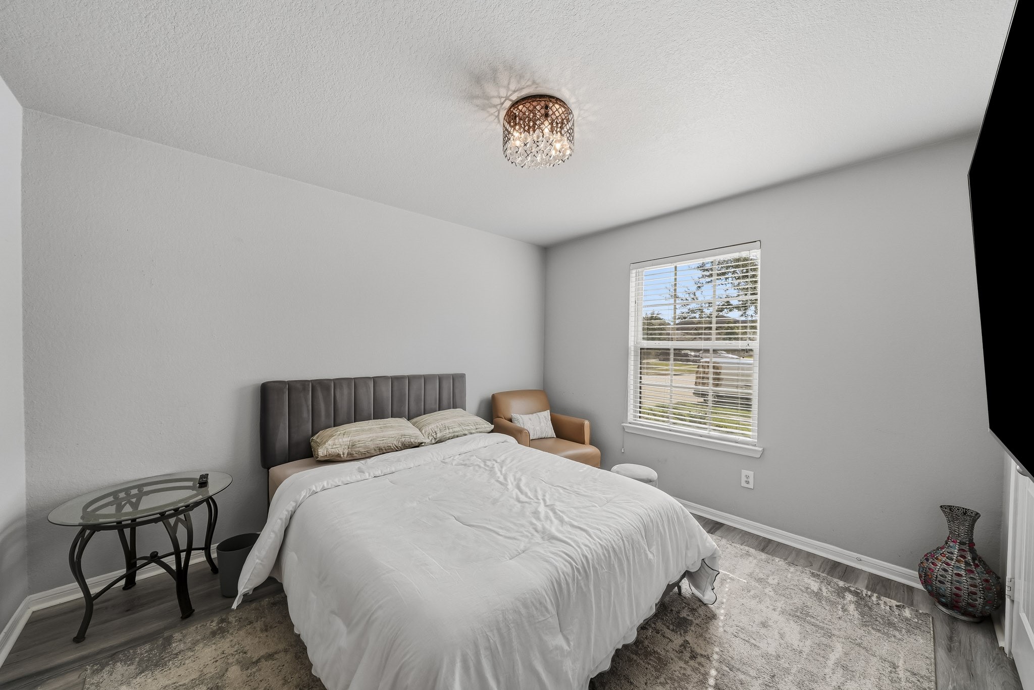 A thoughtfully furnished bedroom offers a welcoming retreat with soft neutral tones, comfortable furnishings, and natural light. A thoughtfully furnished bedroom offers a welcoming retreat with soft neutral tones, comfortable furnishings, and natural light.