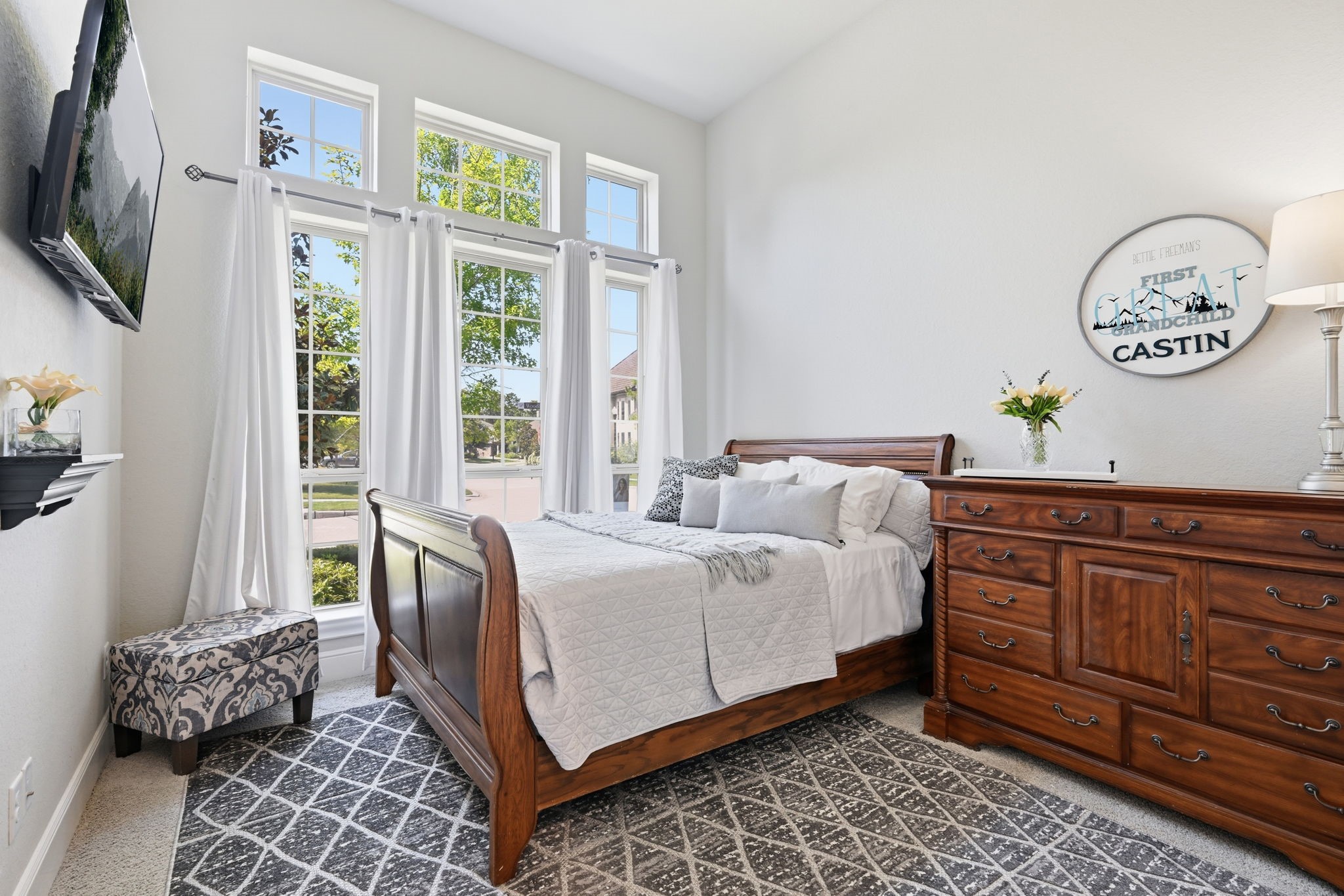 Bedroom 2 is located on the first floor with it's own private bath and features 13' ceilings.