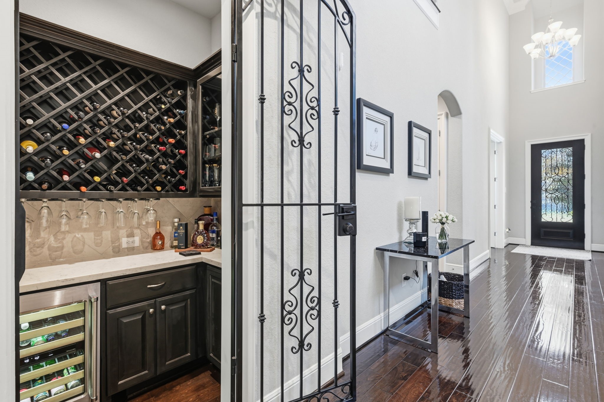 A wine room with a drop down entry is featured central to the home. A wine room with a drop down entry is featured central to the home.