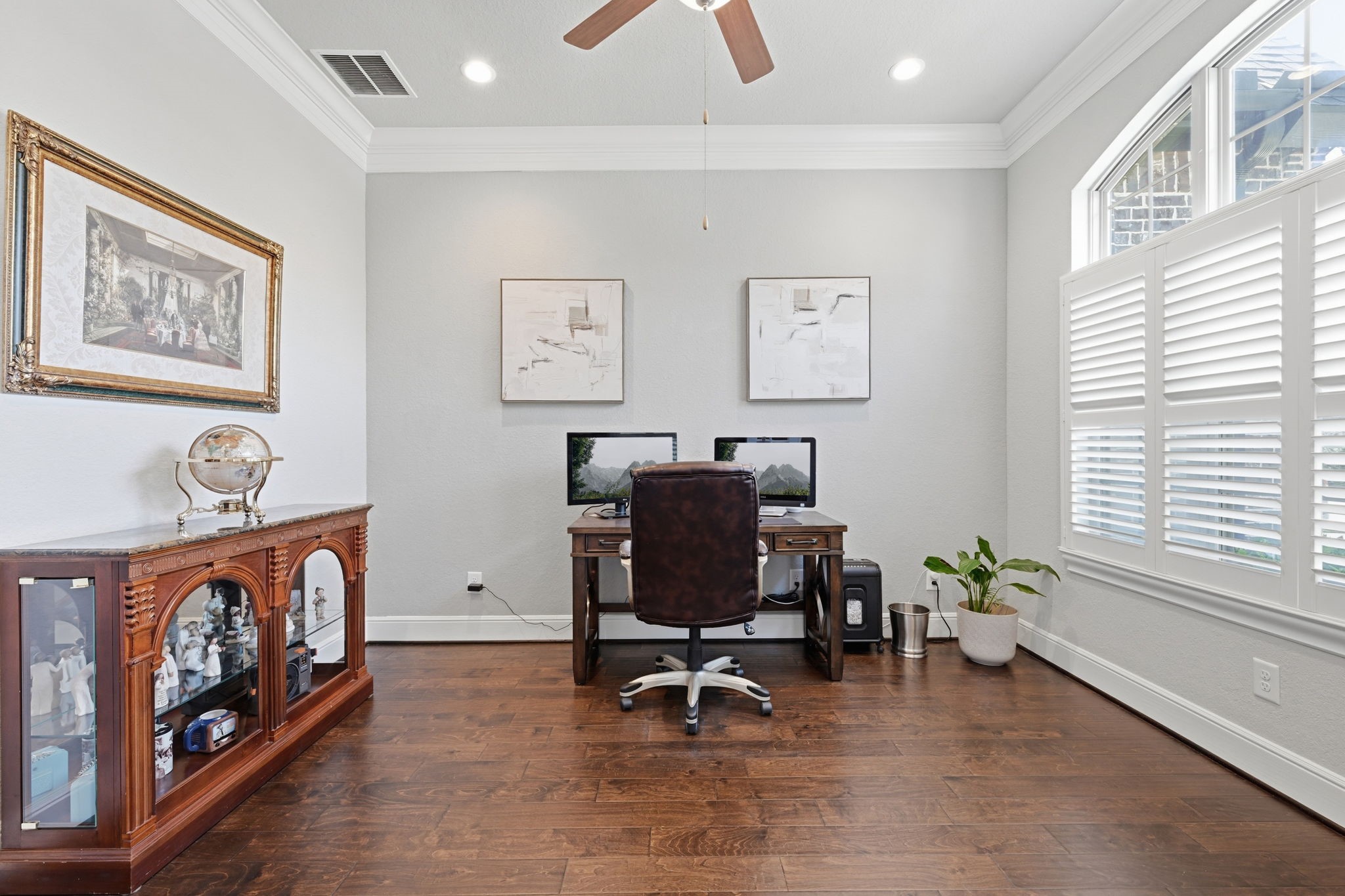 The at-home office is located near the front of the home with lots of natural light.
