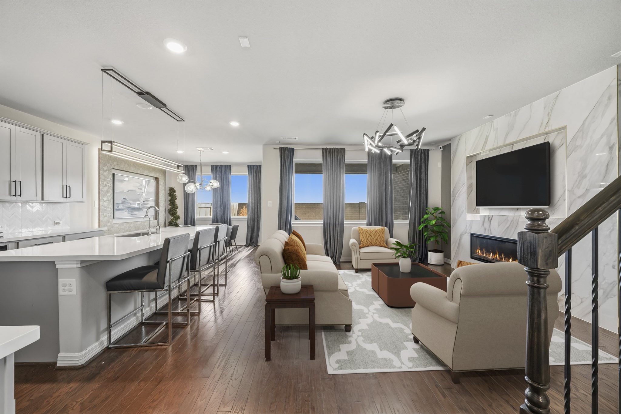 Virtually Staged: This open-concept floor plan creates a seamless connection between the kitchen, dining, and living areas, offering an ideal layout for everyday living and entertaining.