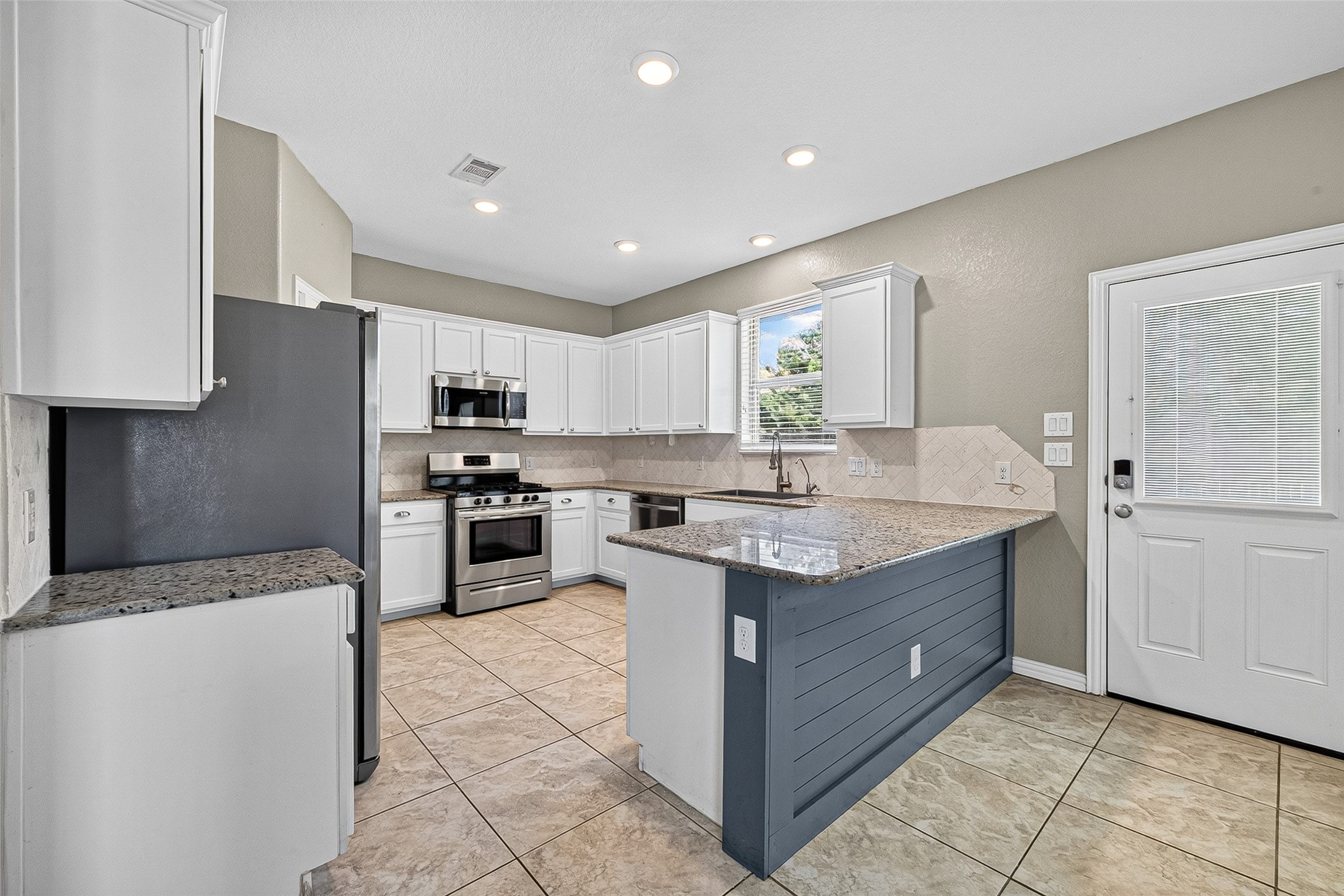 Spacious kitchen, refrigerator included. Not pictured in kitched is a reverse osmosis under sink.