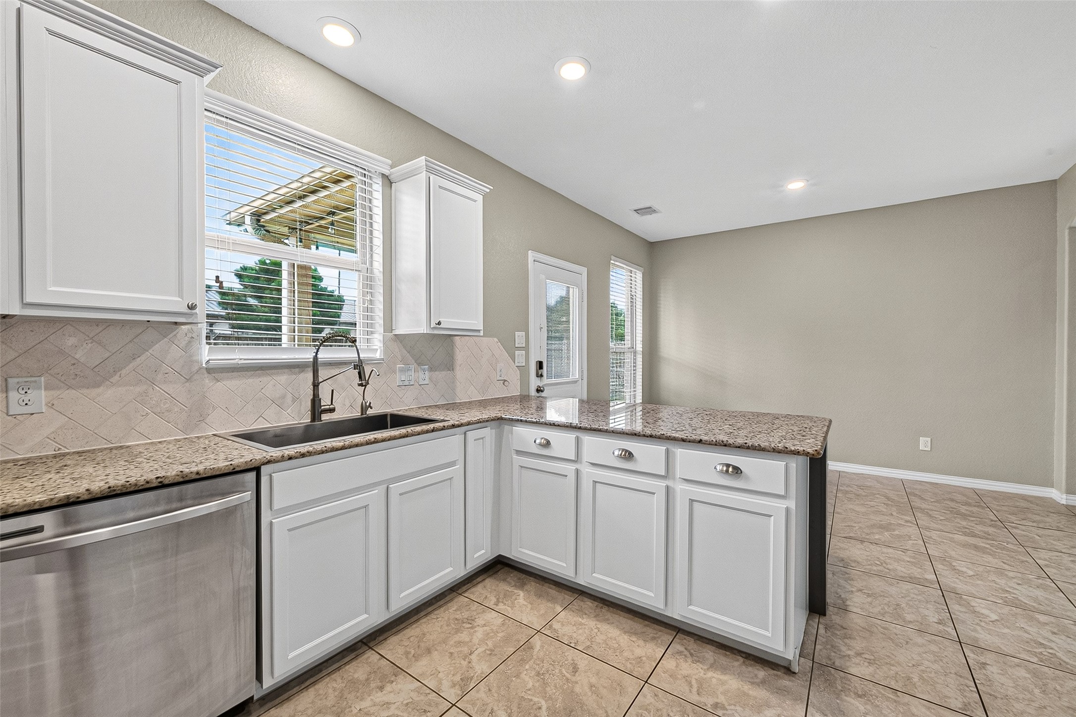 Kitchen overlooking backyard