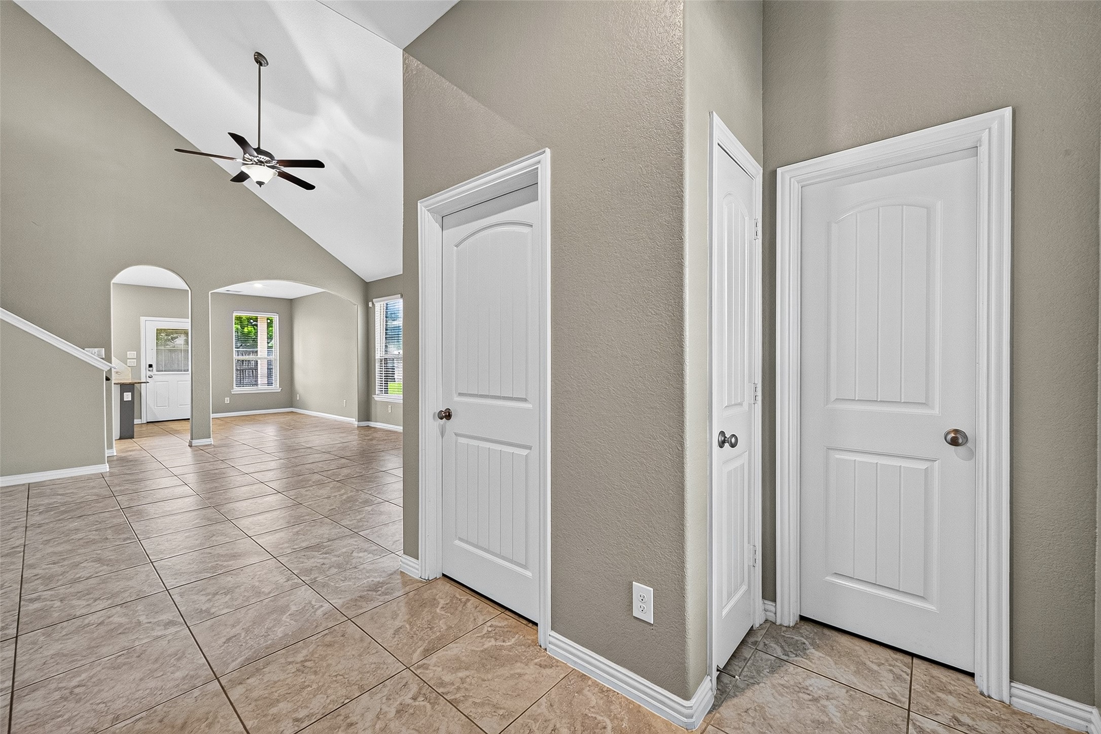 View from front entry looking towards living room. Door to the right is guest bath, washer and dryer room.