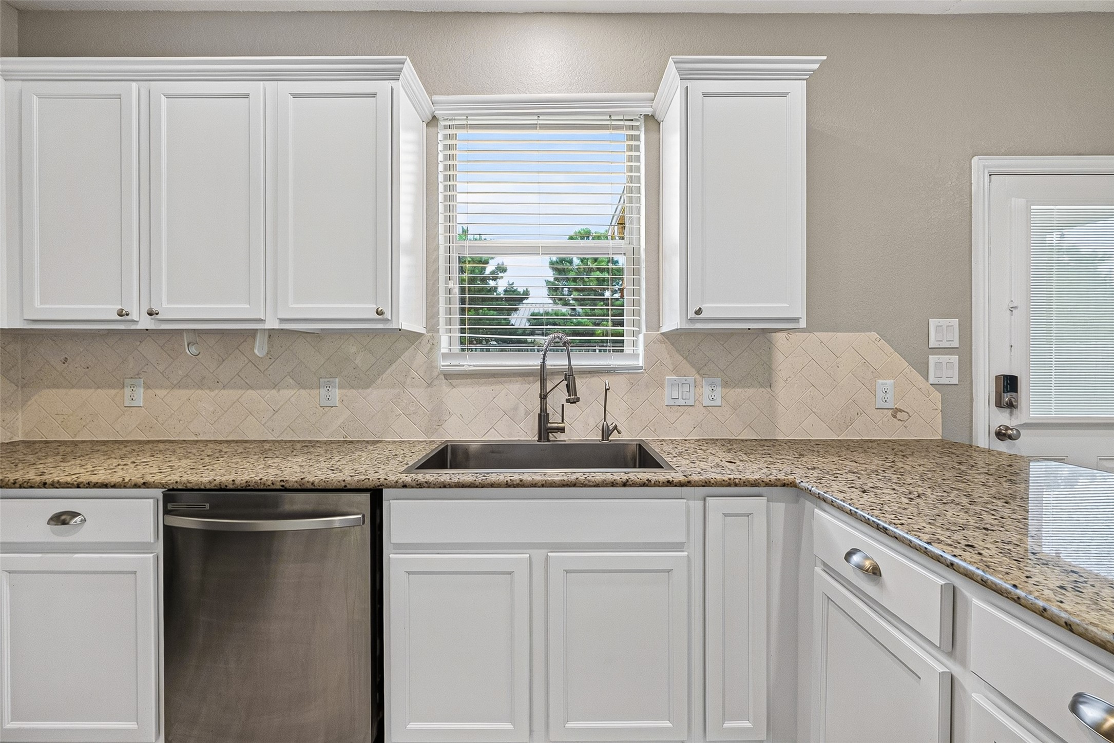 Kitchen overlooking backyard