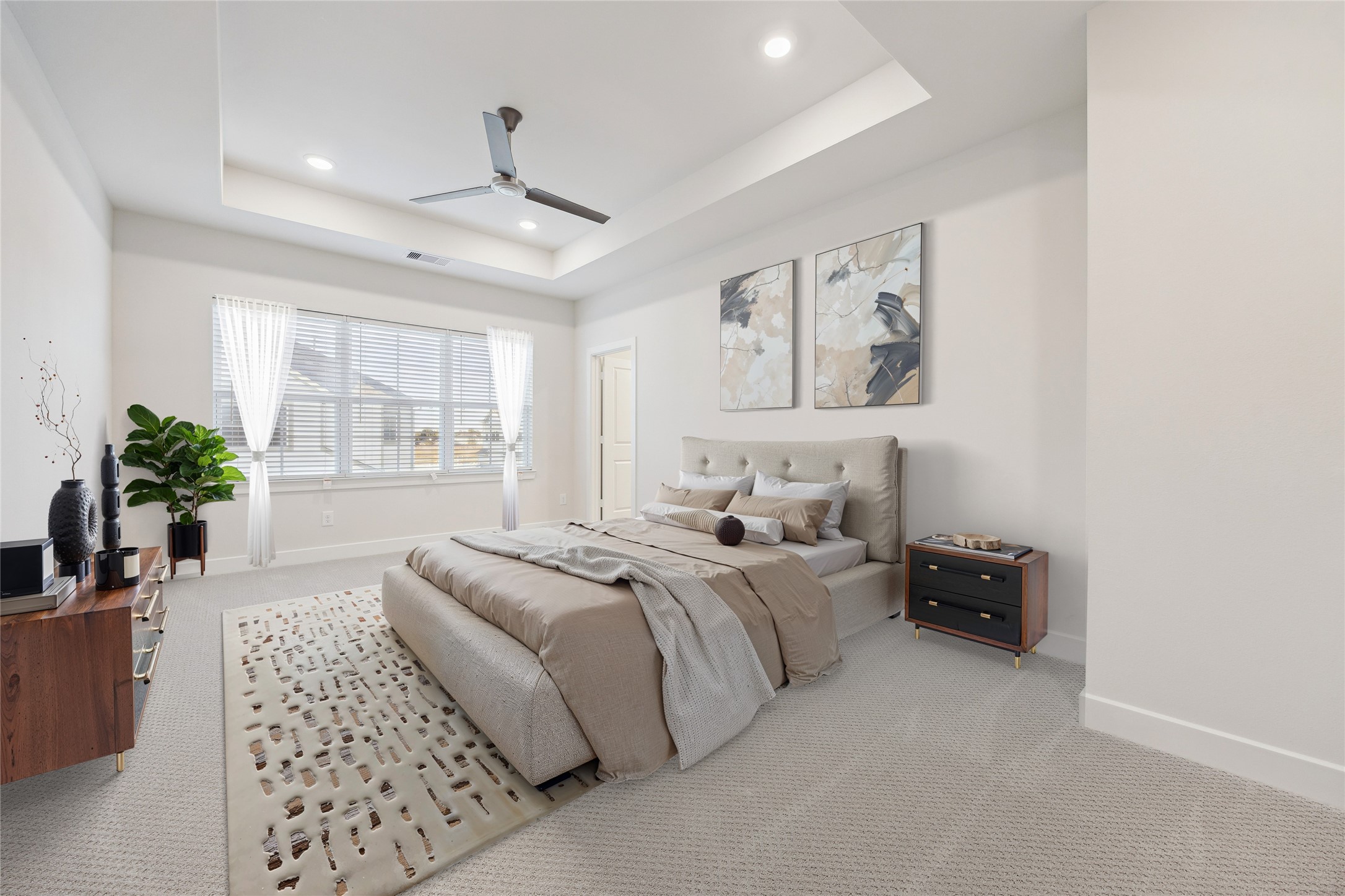 Digitally furnished primary bedroom.