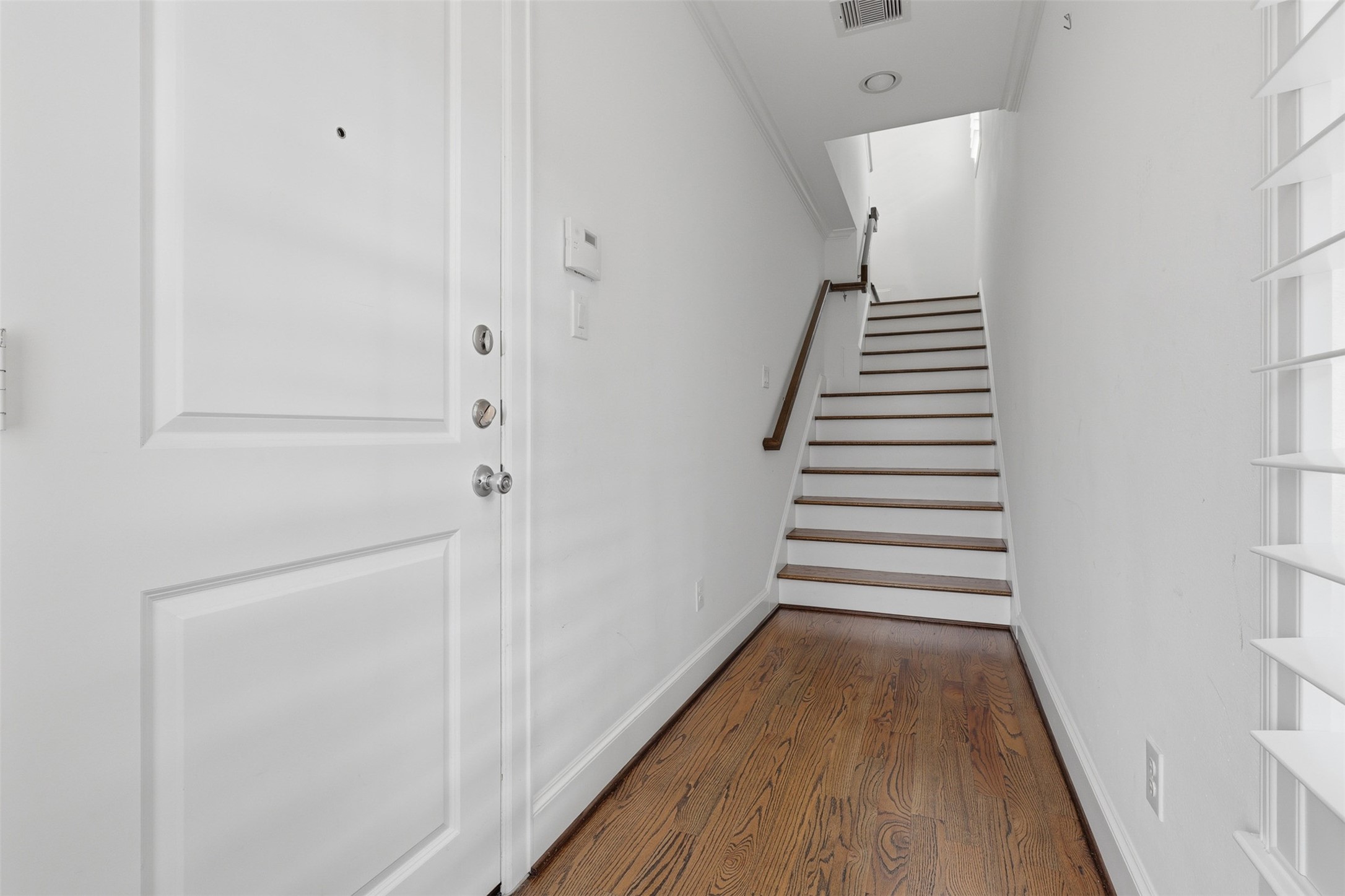 Welcoming entry with door to garage on left. Welcoming entry with door to garage on left.