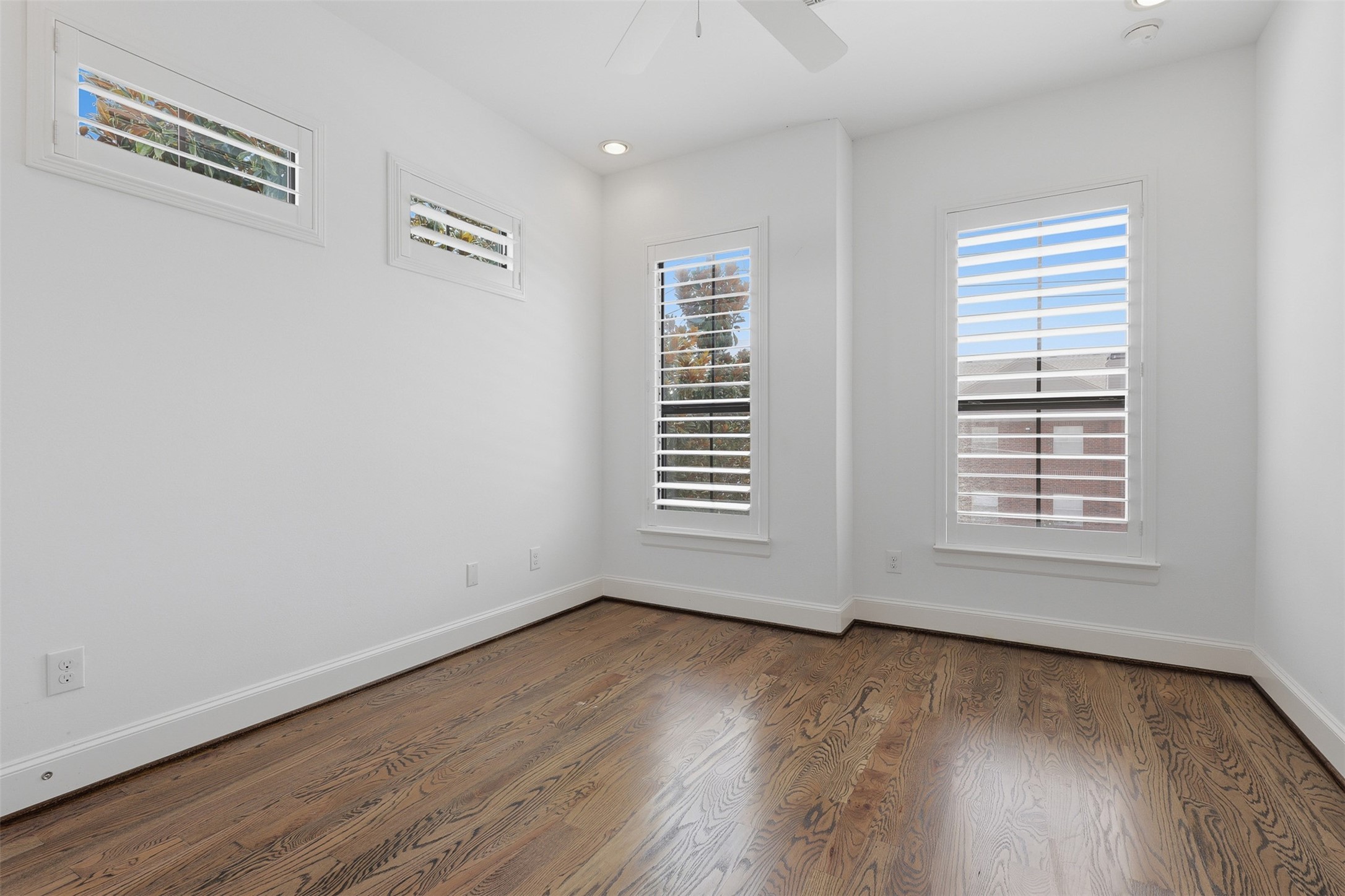 Second bedroom also features hardwoods.