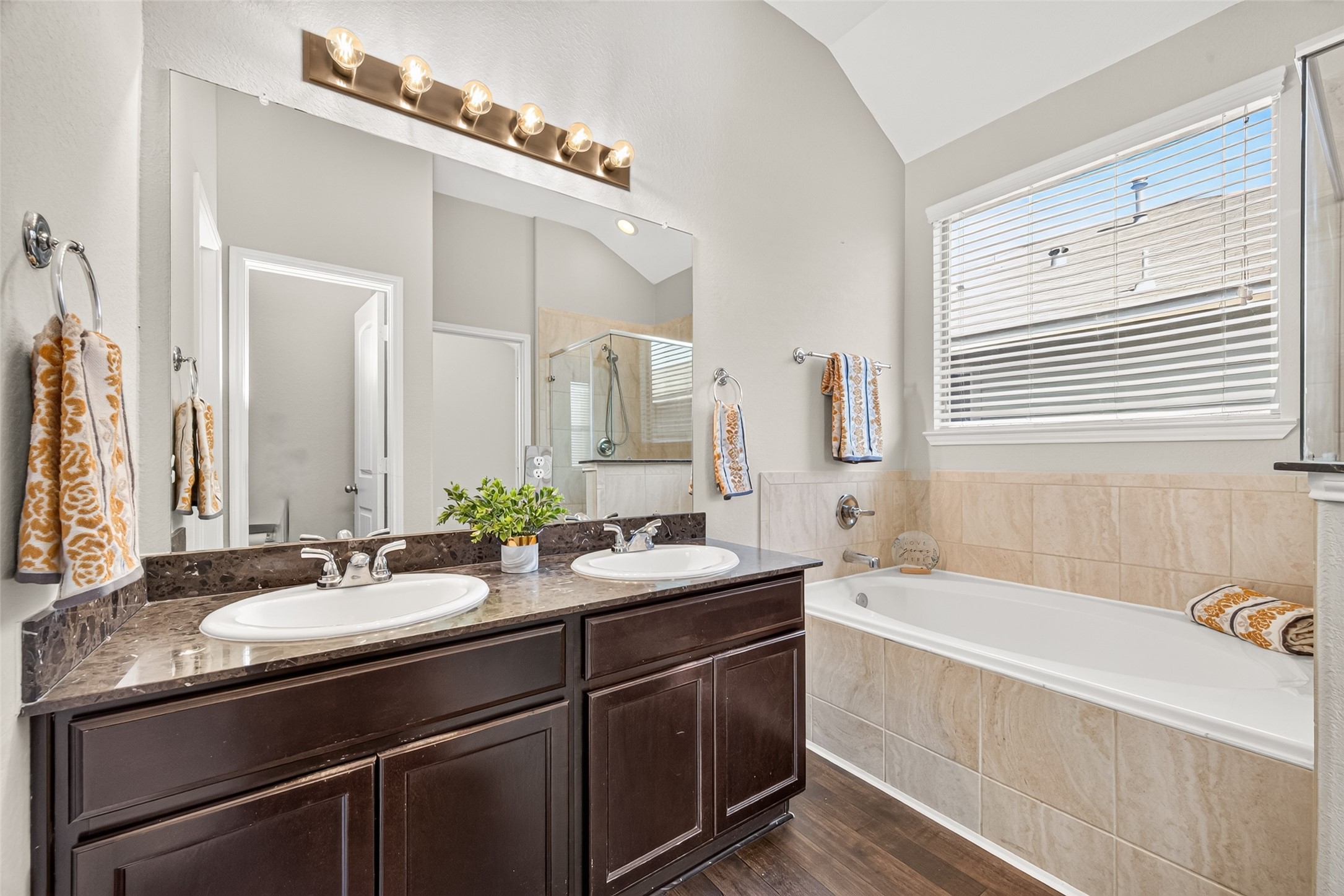 Natural light brightens the bathroom - with double-sink vanity and plenty of countertop space for your daily routine