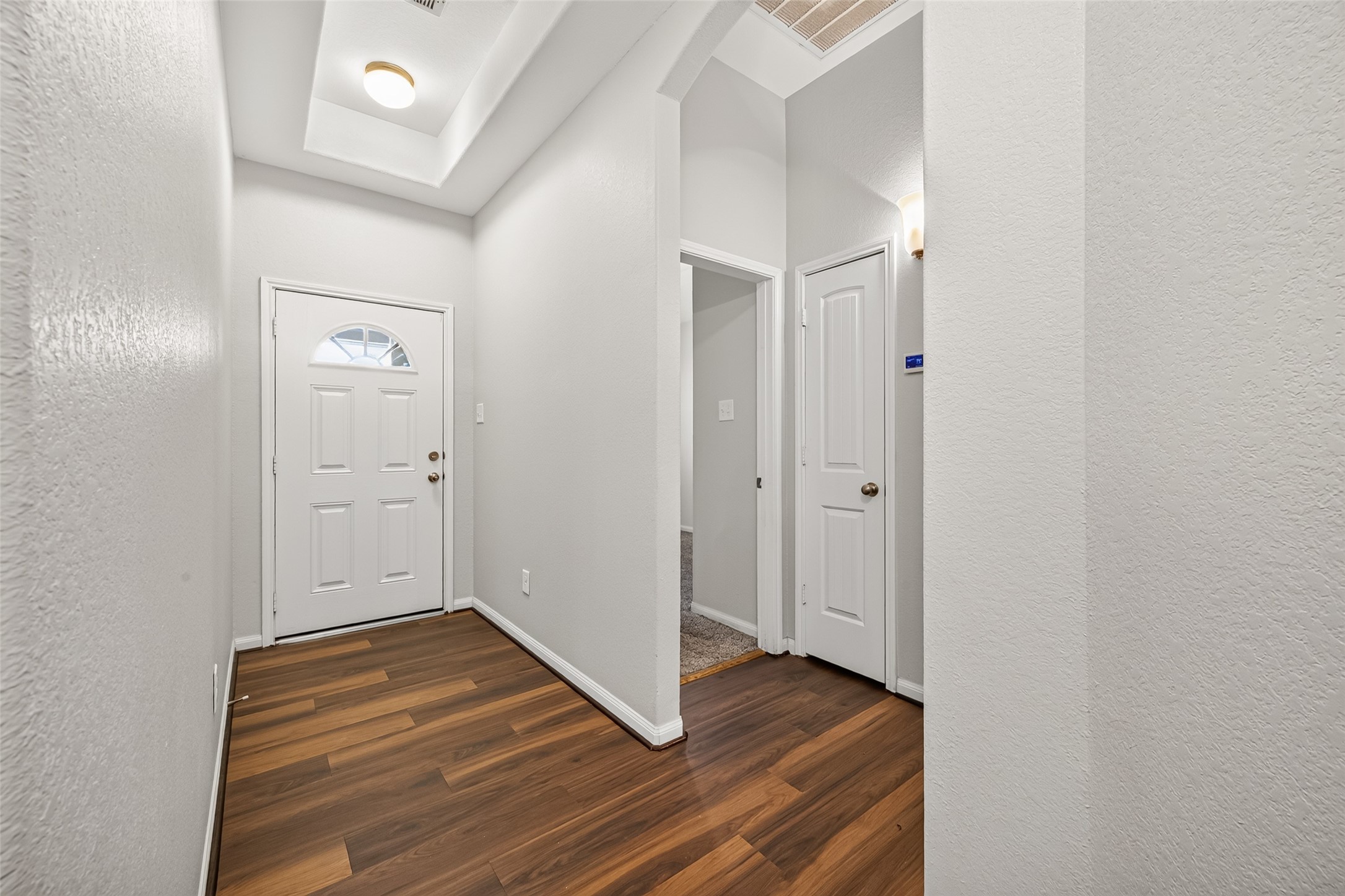 Fresh interior paint and attractive wood-look laminate flooring give the home a clean, updated feel.