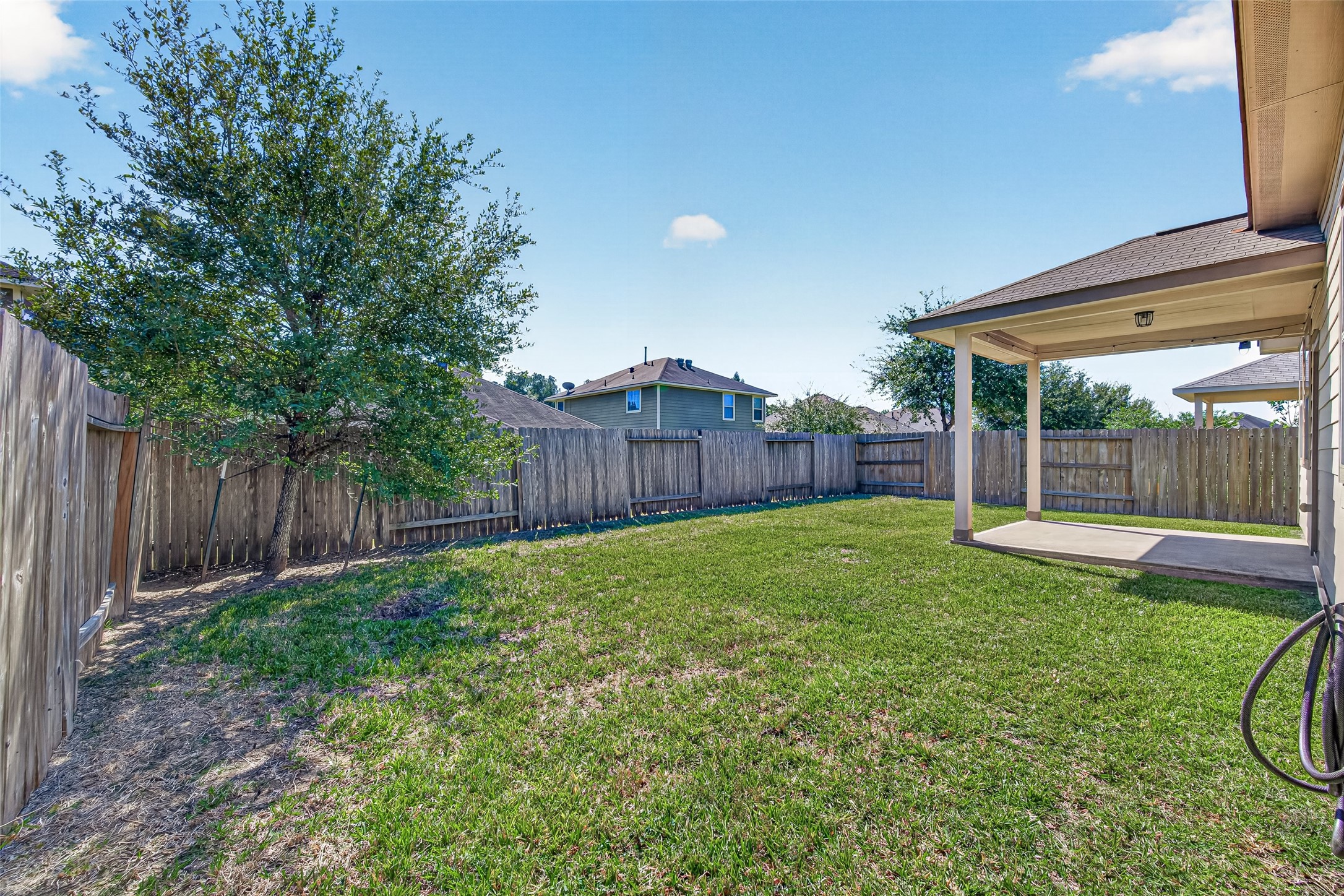 There is plenty of room to spread out and enjoy this nicely sized backyard.
