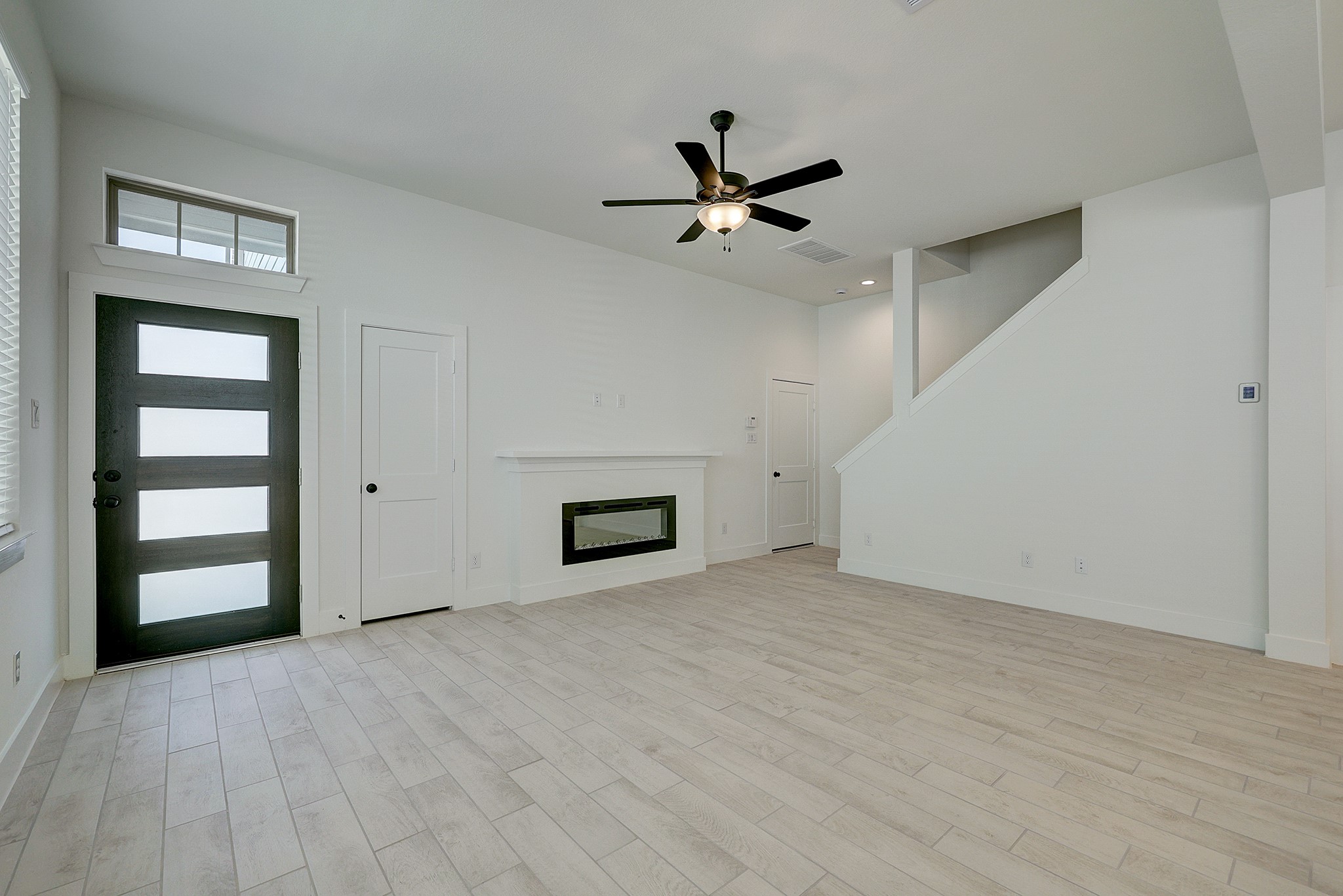 Spacious family room with modern fireplace. Spacious family room with modern fireplace.