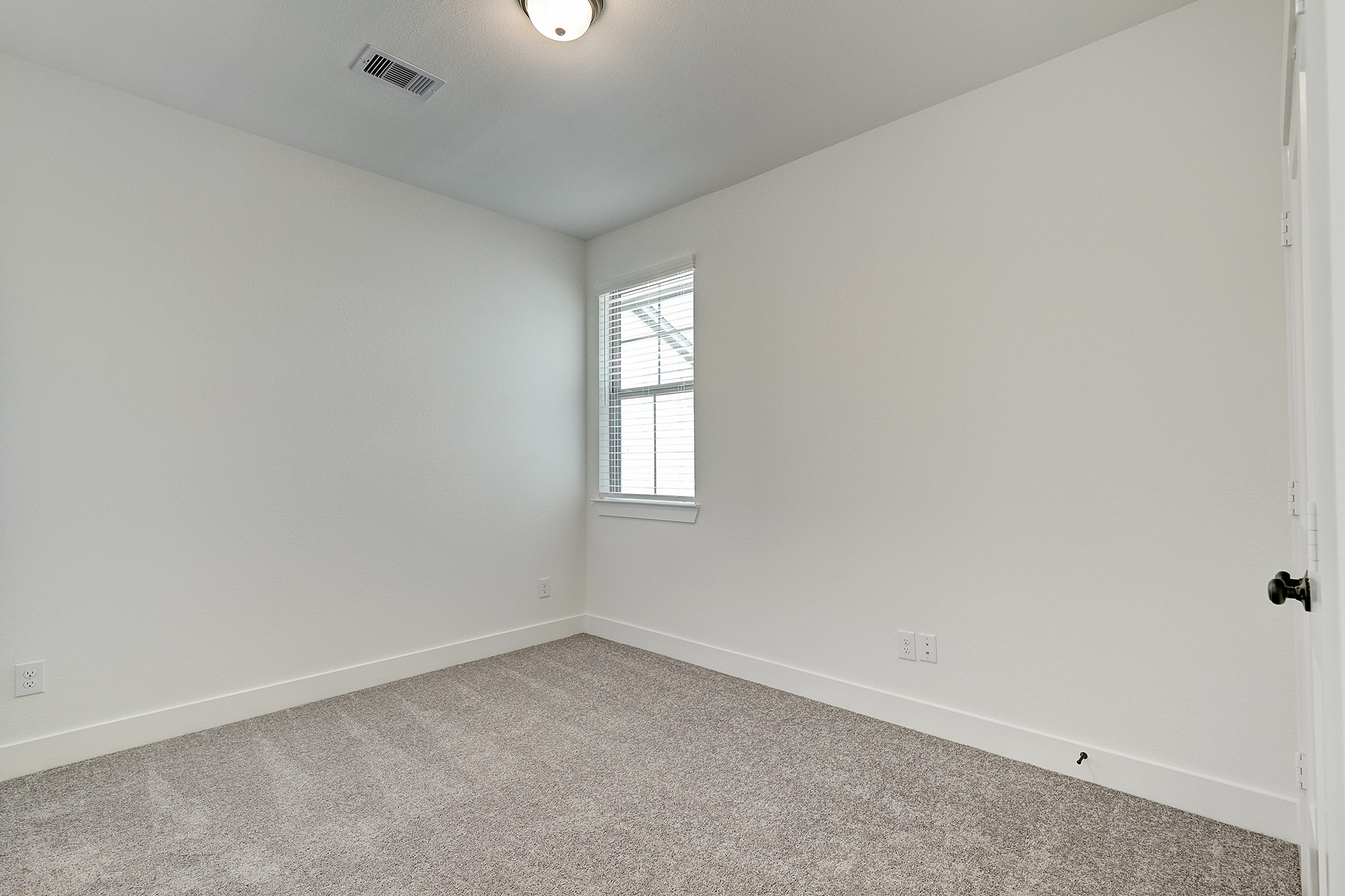Additional upstairs bedroom offers flexible living space.