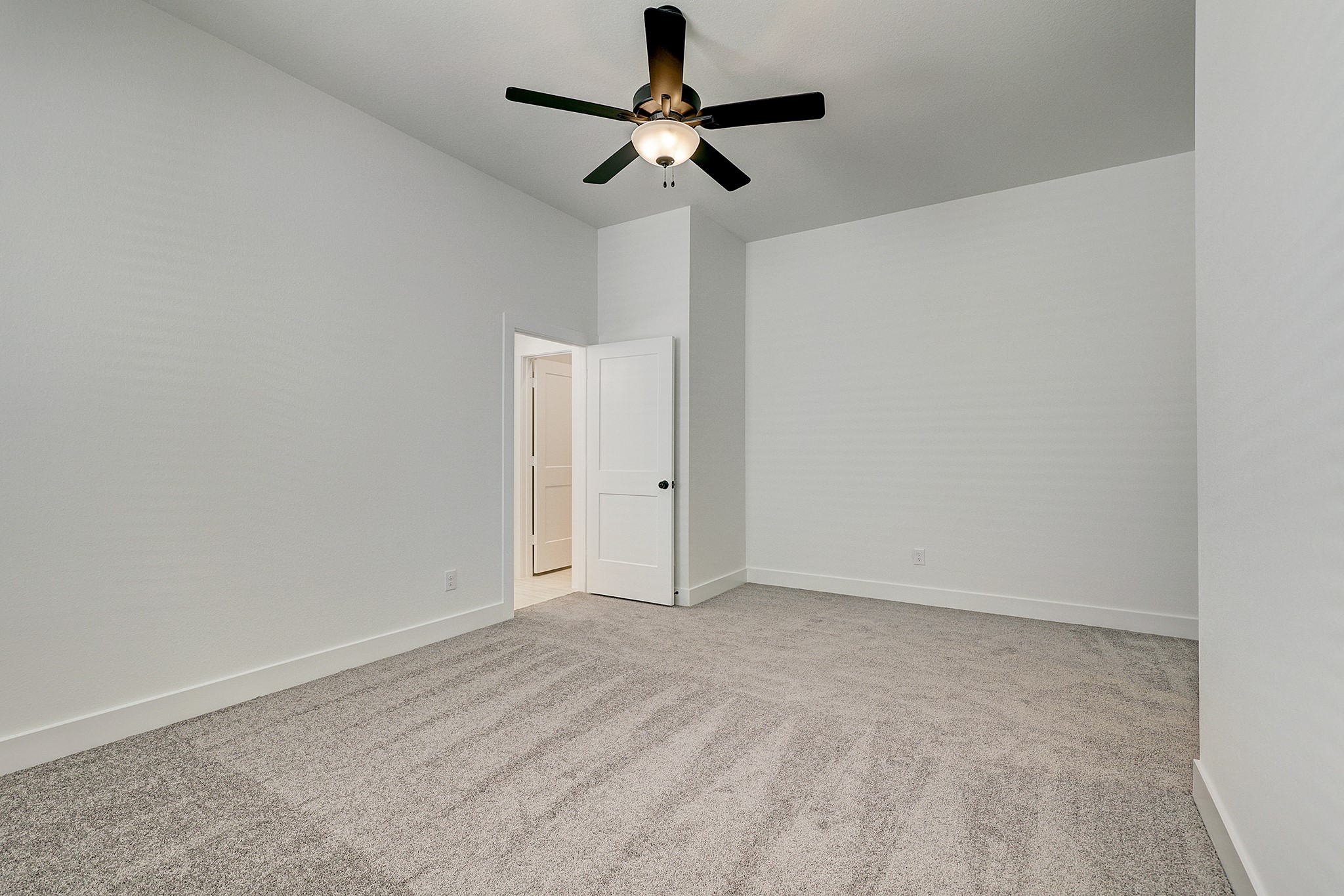Another view of the primary bedroom.