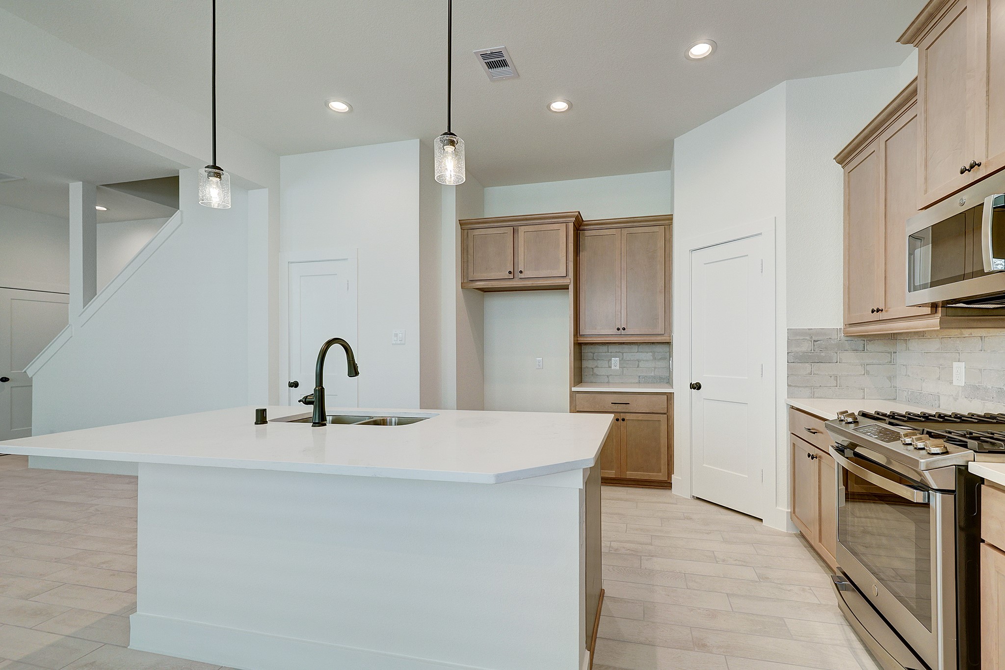 Clean, modern kitchen with excellent storage and workspace.