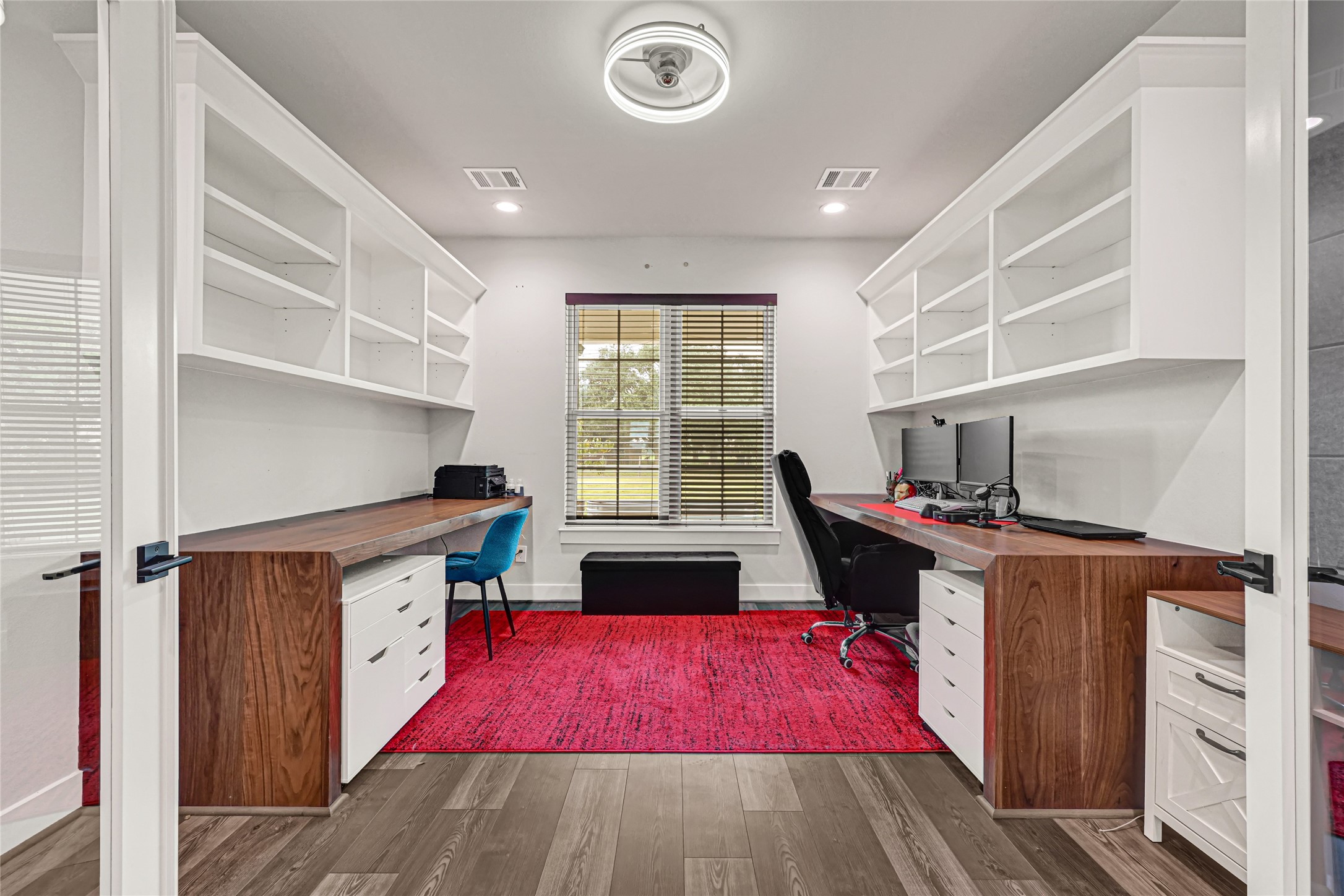 Home office with glass french doors, 2 built in 3x8  Walnut desks and upper shelving
