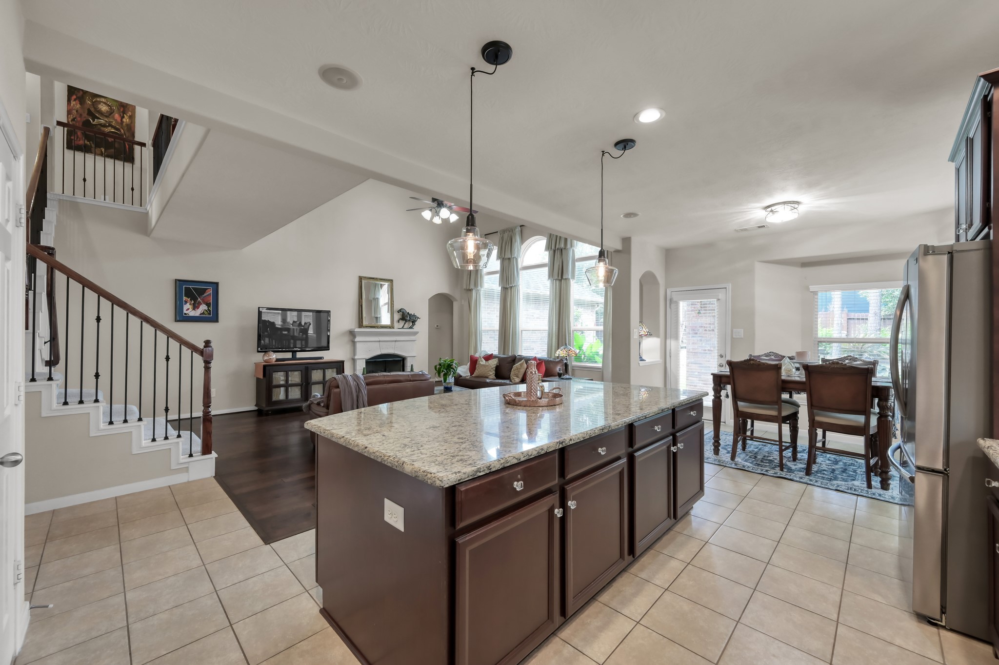 Large center island with additional storage and seating offers the ideal spot for casual meals, coffee mornings, or gathering with friends and family.