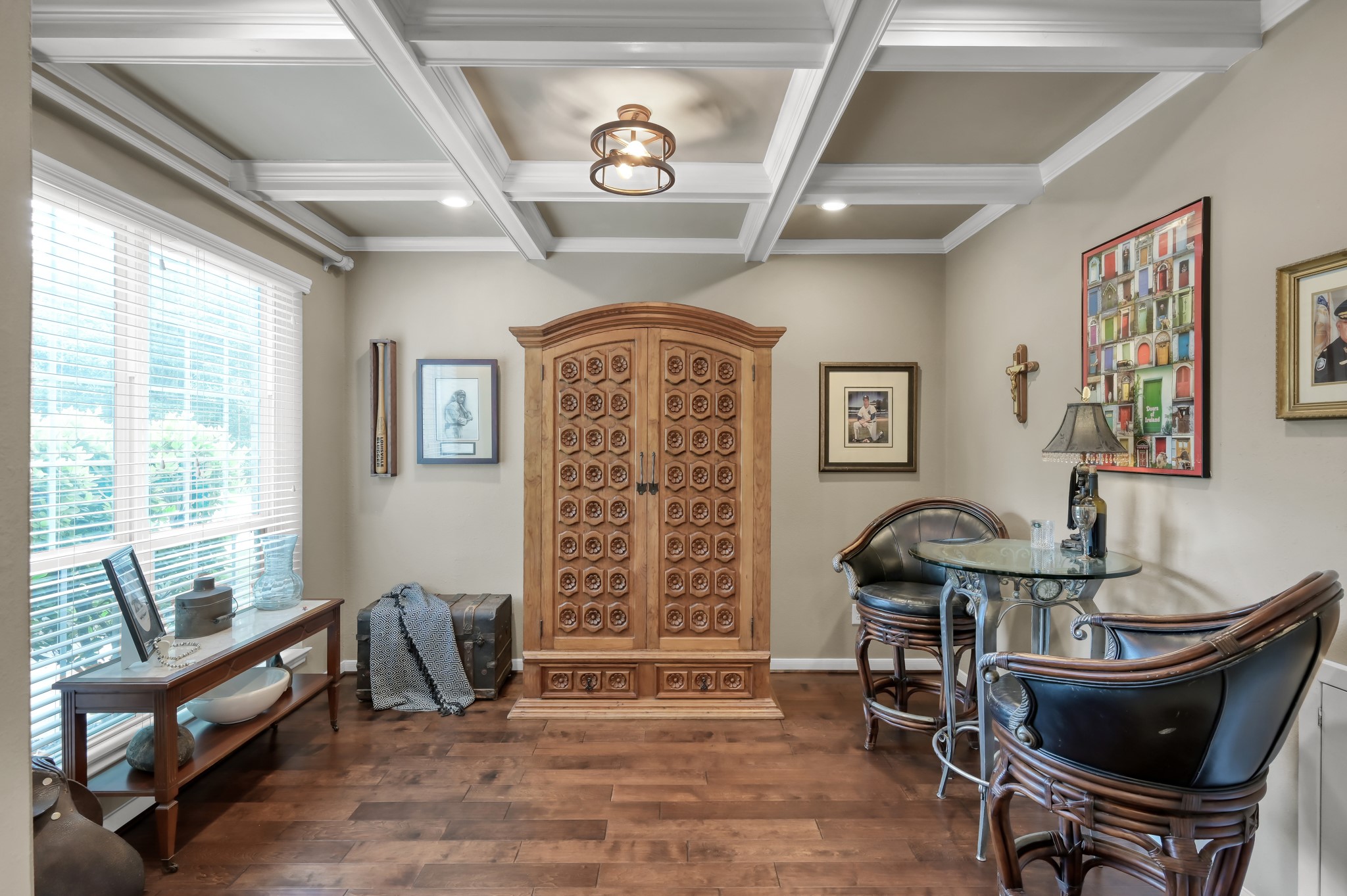 This beautiful formal dining room combines warmth and elegance with custom ceiling details, rich flooring, and large windows that bring in plenty of natural light. This beautiful formal dining room combines warmth and elegance with custom ceiling details, rich flooring, and large windows that bring in plenty of natural light.