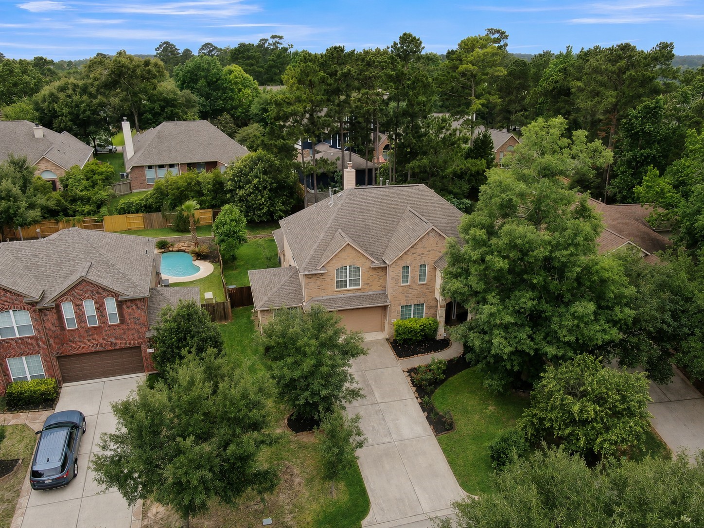 Enjoy attractive curb appeal, a long driveway, lush landscaping, and a private backyard setting with plenty of green space. Conveniently located near shopping, dining, parks, and top-rated schools while still offering a peaceful, tucked-away feel.