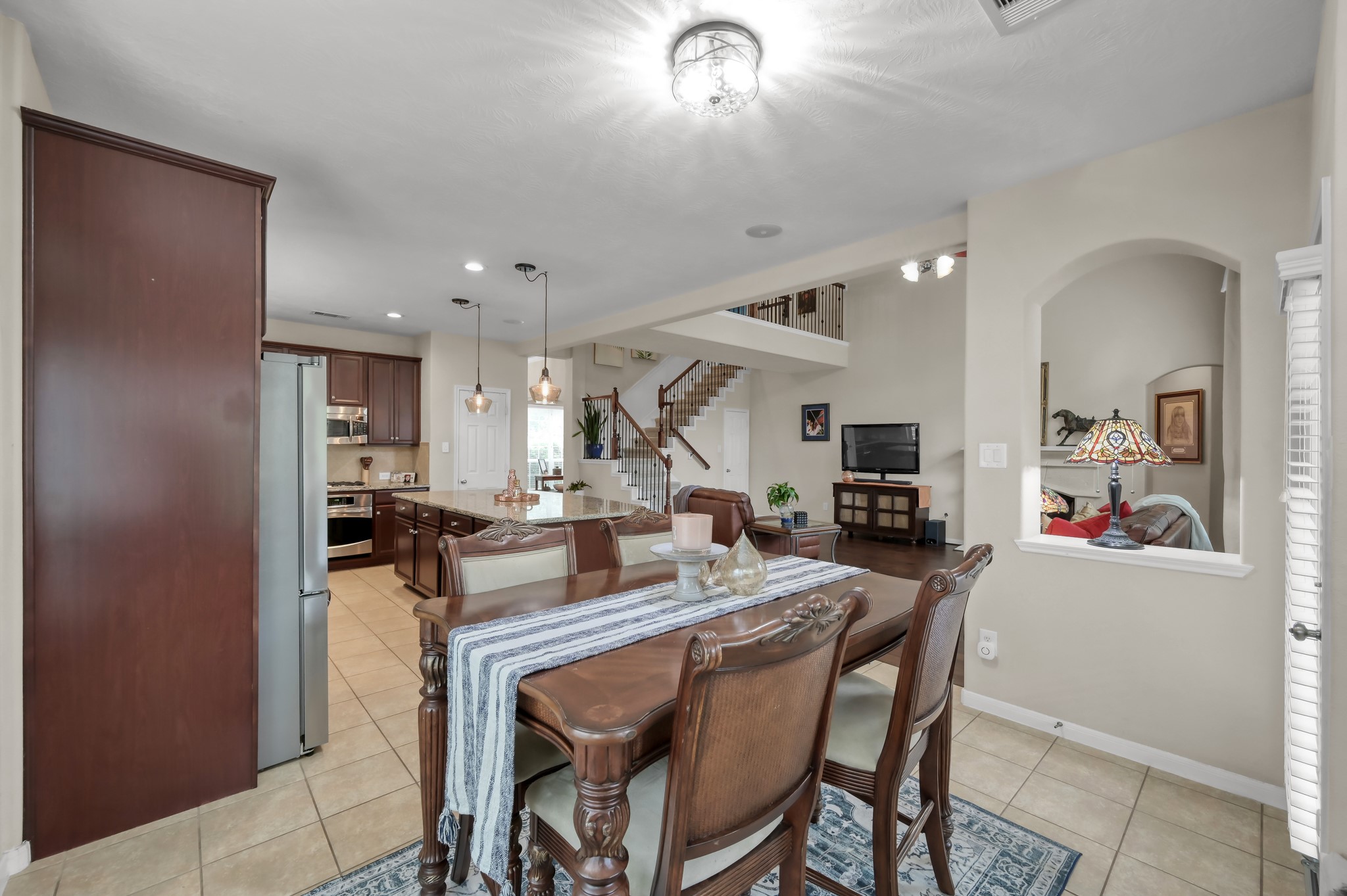 The breakfast area flows seamlessly into the kitchen and living spaces, creating the perfect setup for entertaining and everyday living.