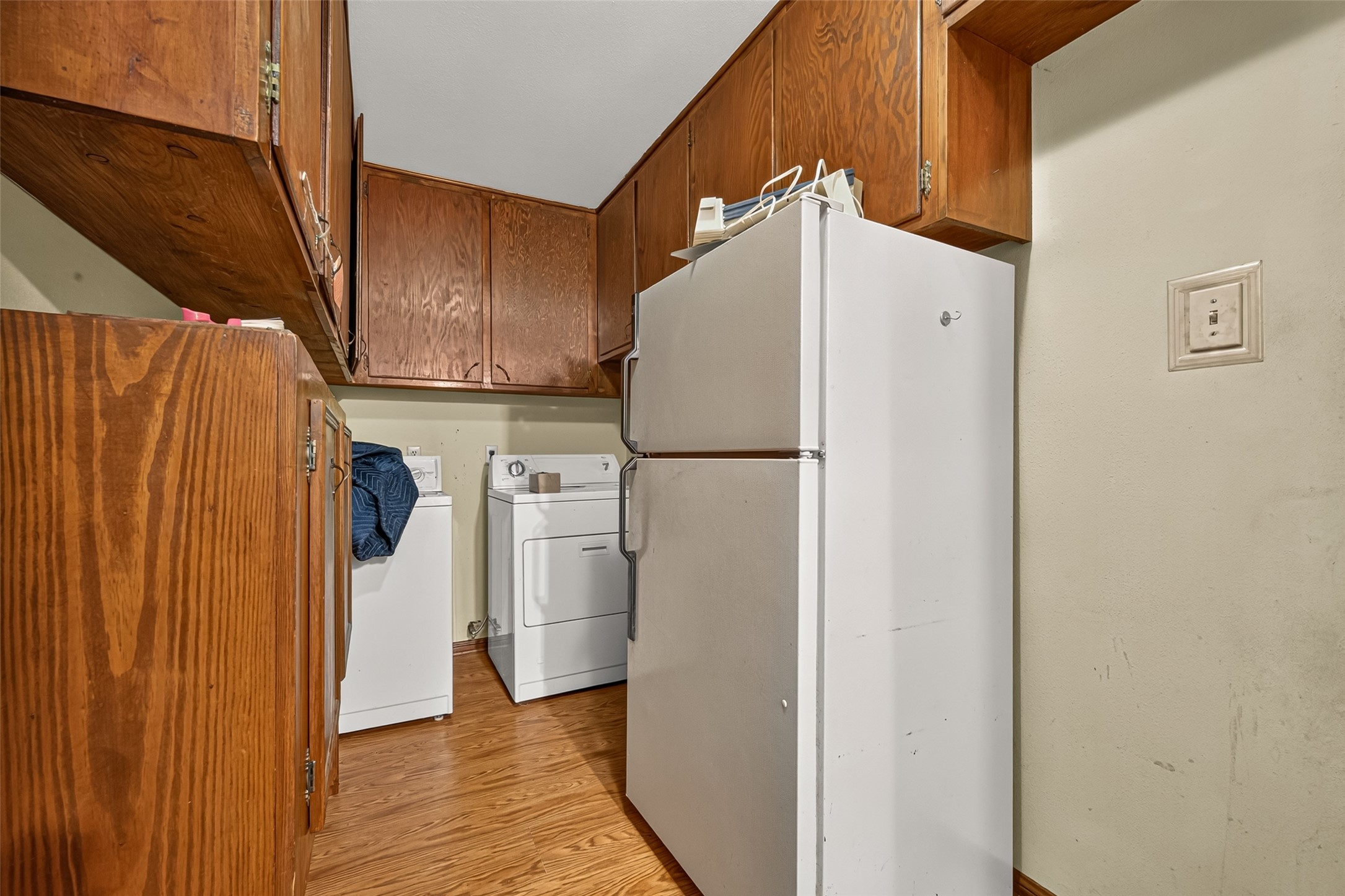 Oversized Laundry room right off the kitchen and houses a half bath.