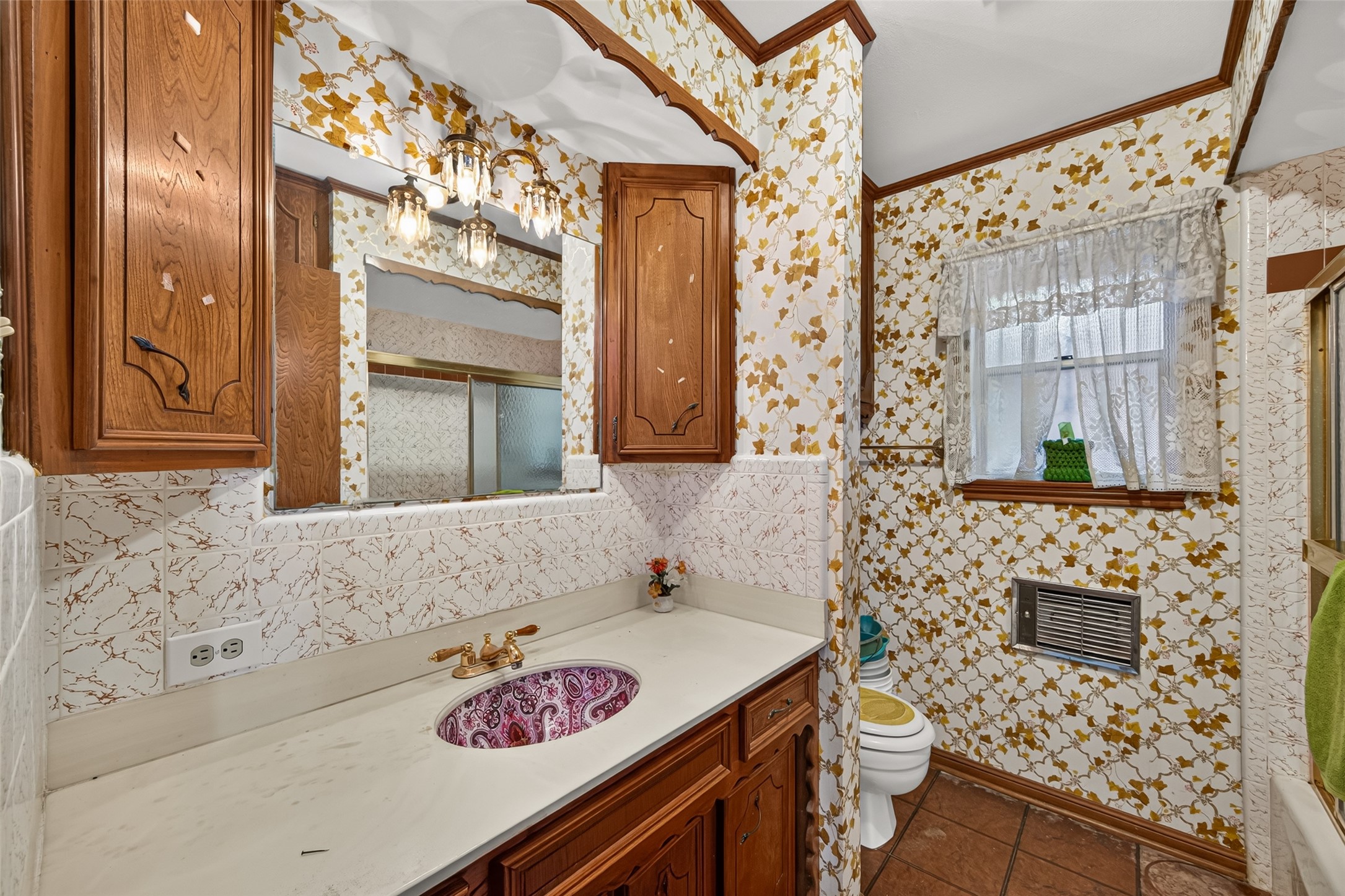 Primary bathroom, would you keep the sink bowl and original wood cabinets?