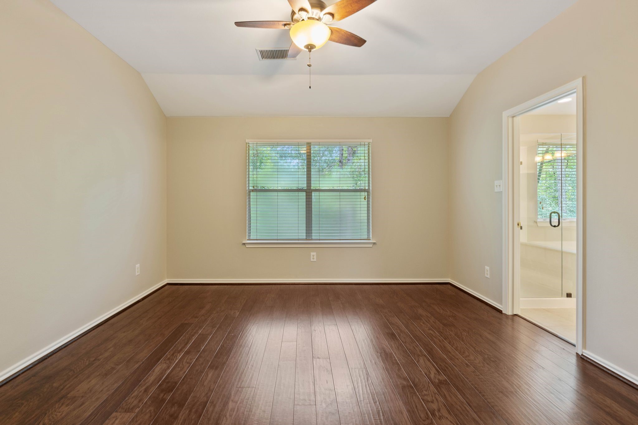 second floor master bedroom with gleaming wood floors