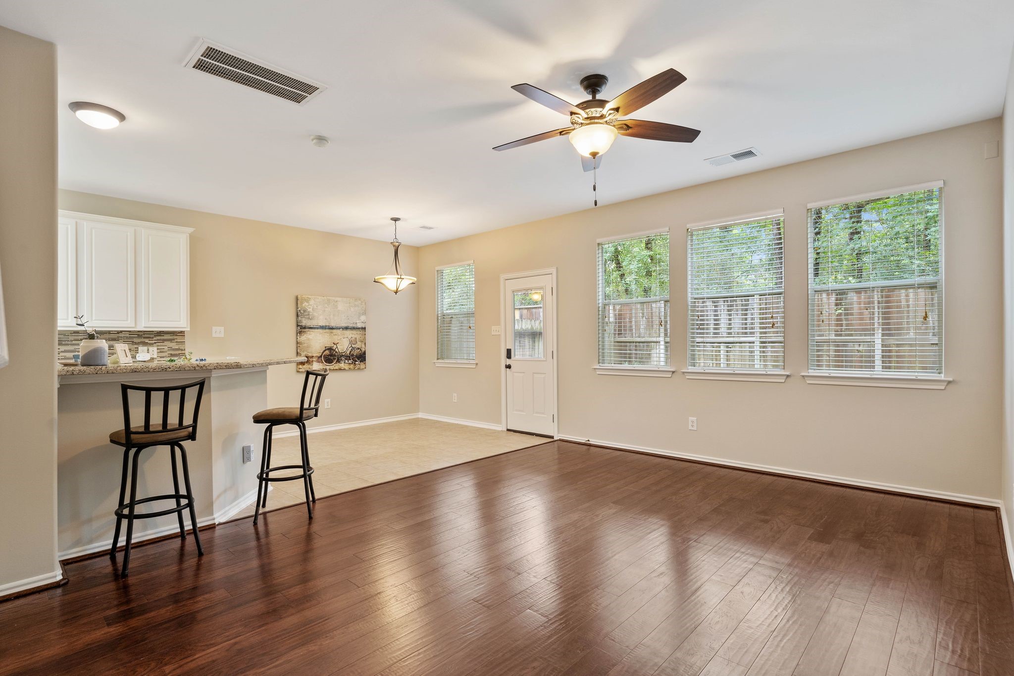 beautiful hardwood floors, freshly painted interiors, brand new HVAC system, windows included blinds, backyard is fully fenced (now has new fence) and the unit sits on the end with woods and greenbelt surrounding