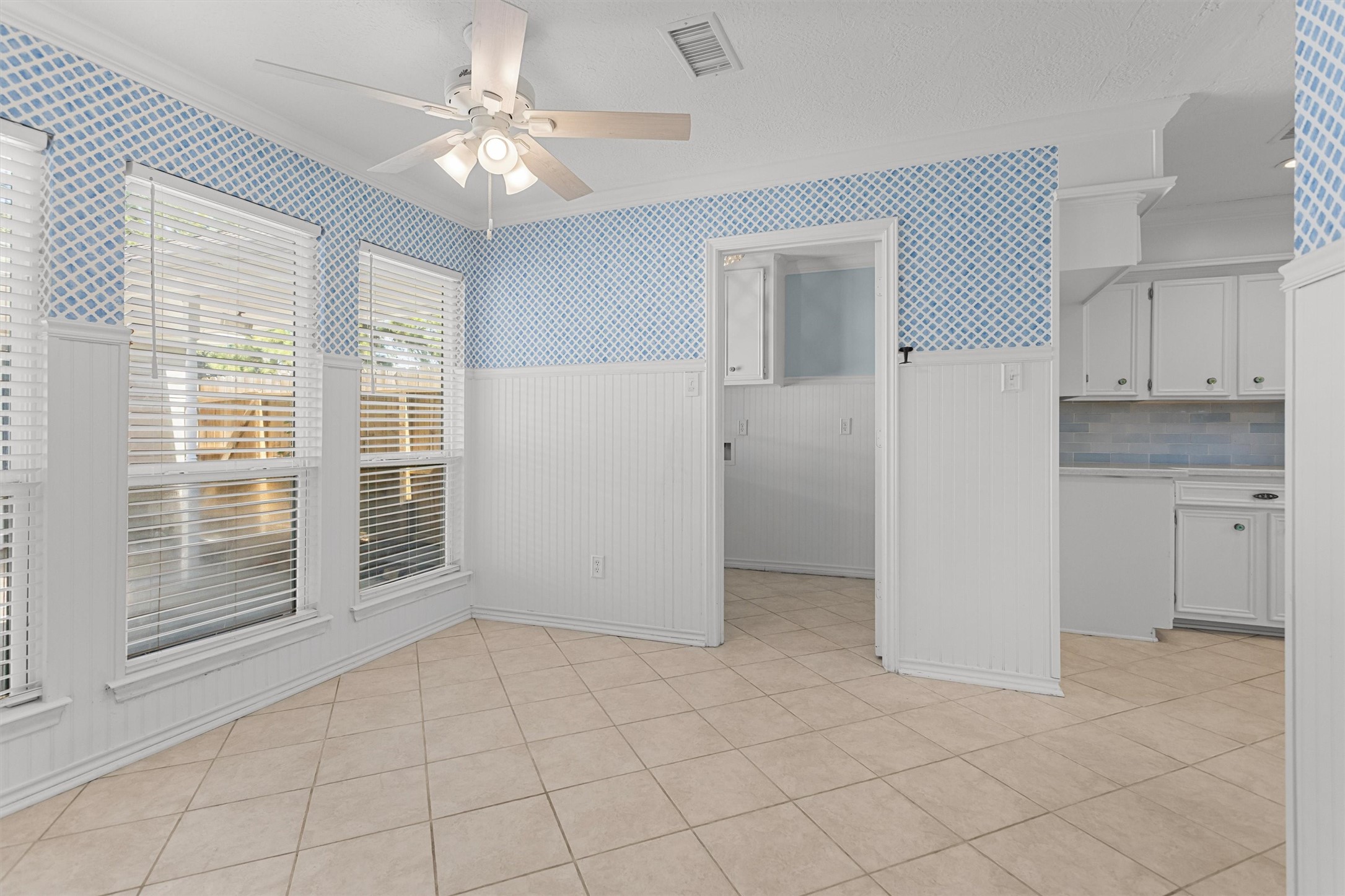 Breakfast room with Wainscoting and Double-paned Windows