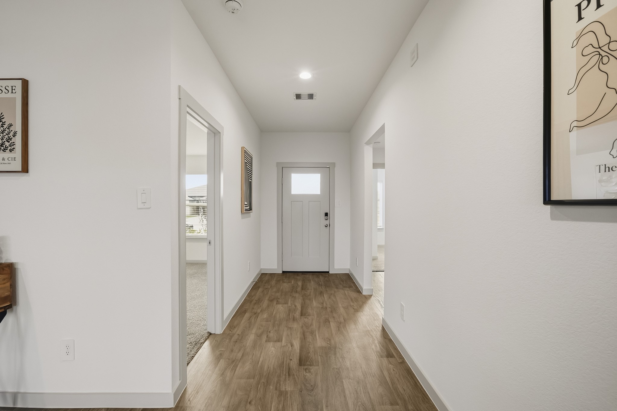 Nice wide foyer into a large family room with light and bright features.