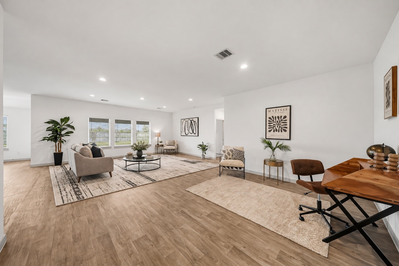 This would be a great formal dining area where the current office is located or a study/reading area.