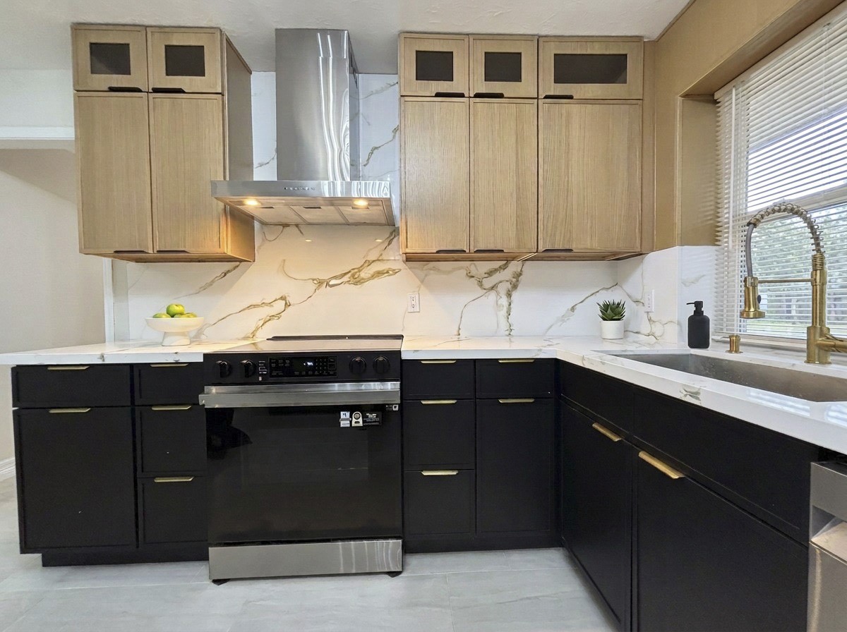 New cabinets, quartz countertop, and matching backsplash.