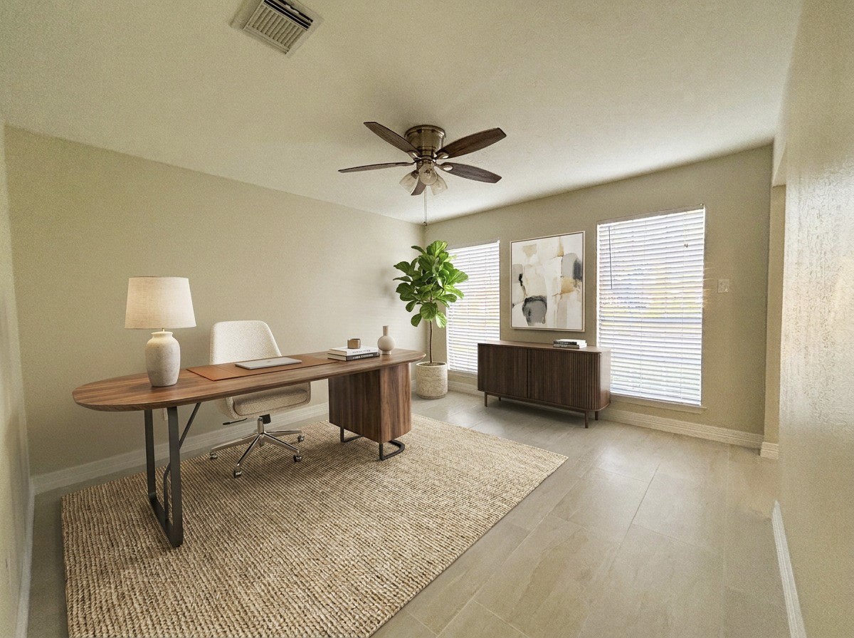 Flexible space ideal for a home office or formal living room (Virtually staged).